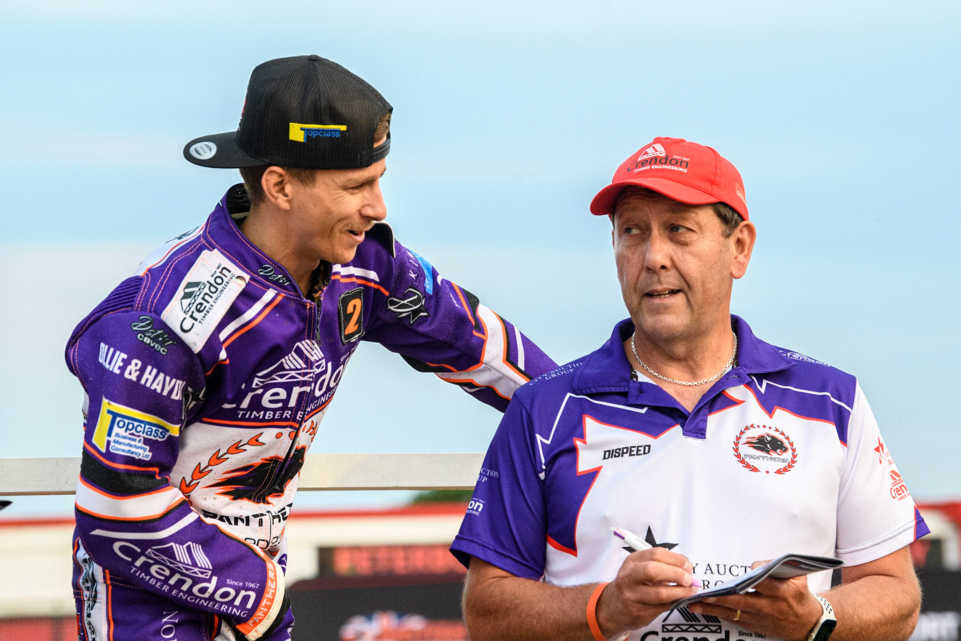 Ben Cook (left) chats with Peterborough Crendon Panthers Team Manager Rob Lyon during the Sports Insure Premiership match between Peterborough and Belle Vue Aces at East of England Showground, Peterborough on Monday 26th June 2023. (Photo: Ian Charles | MI News)