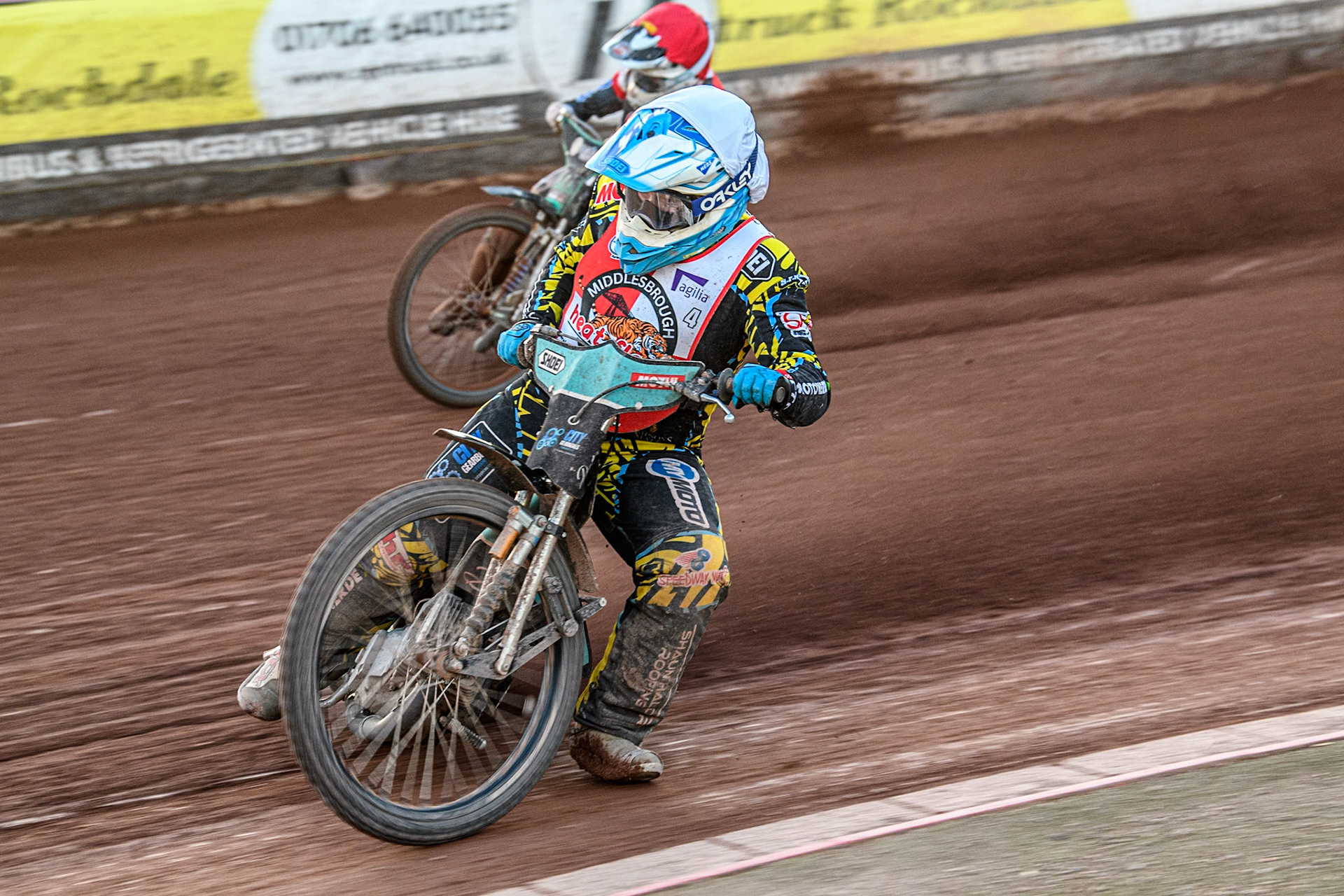 Middlesbrough Tigers' Jamie Halder in White leading Belle Vue Colts' Guest rider Mason Watson in Red during the WSRA National Development League match between Belle Vue Colts and Middlesbrough Tigers at the National Speedway Stadium, Manchester on Monday 17th June 2024. (Photo: Ian Charles | MI News)