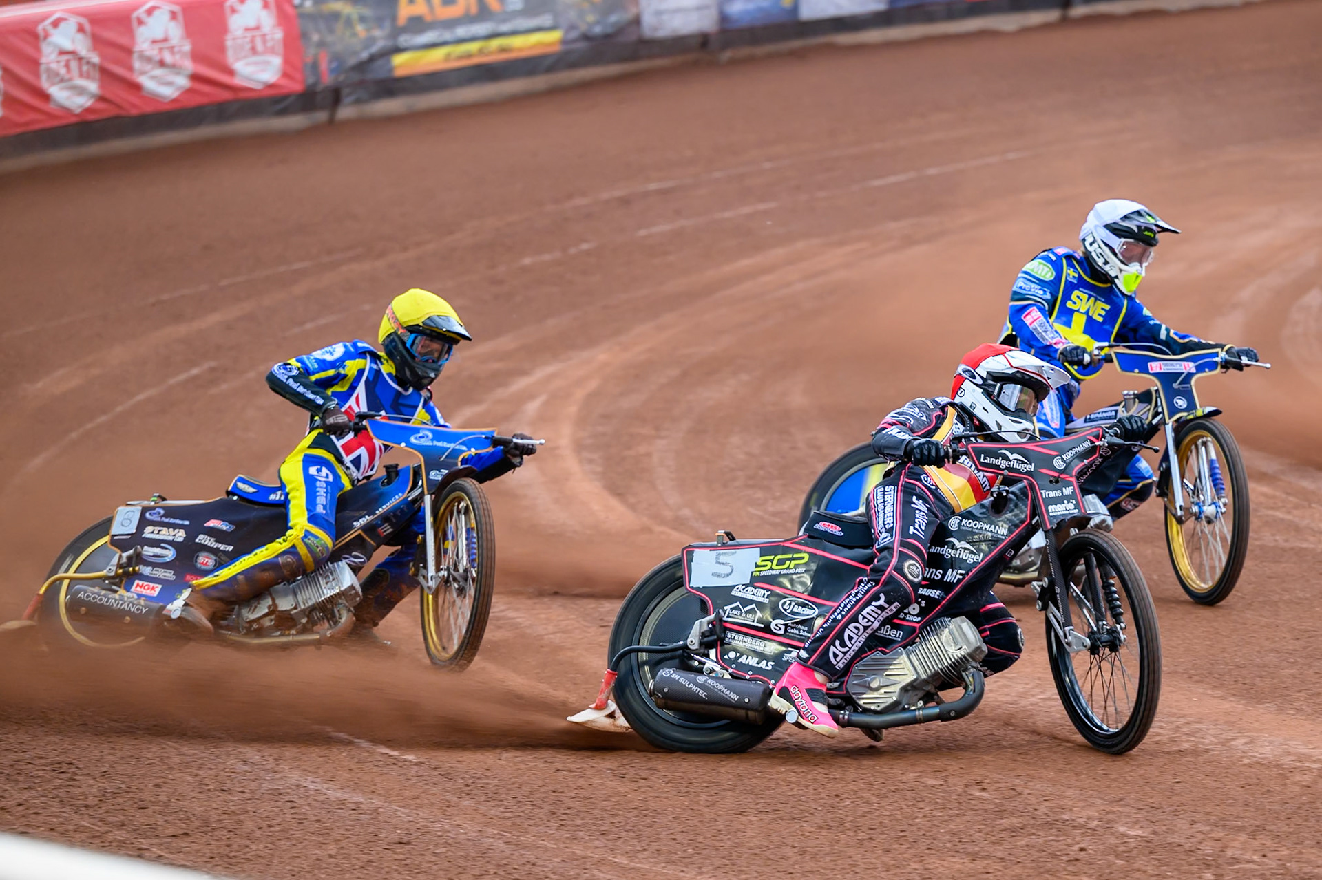 Kai Huckenbeck of Germany in Red leading Victor Palovaara of Sweden in White and Anders Rowe of Great Britain in Yellow during the Speedway GP Qualifying Round 3 at Allied Ashfield Stadium, Glasgow on Saturday 30th May 2026. (Photo: Ian Charles | MI News)