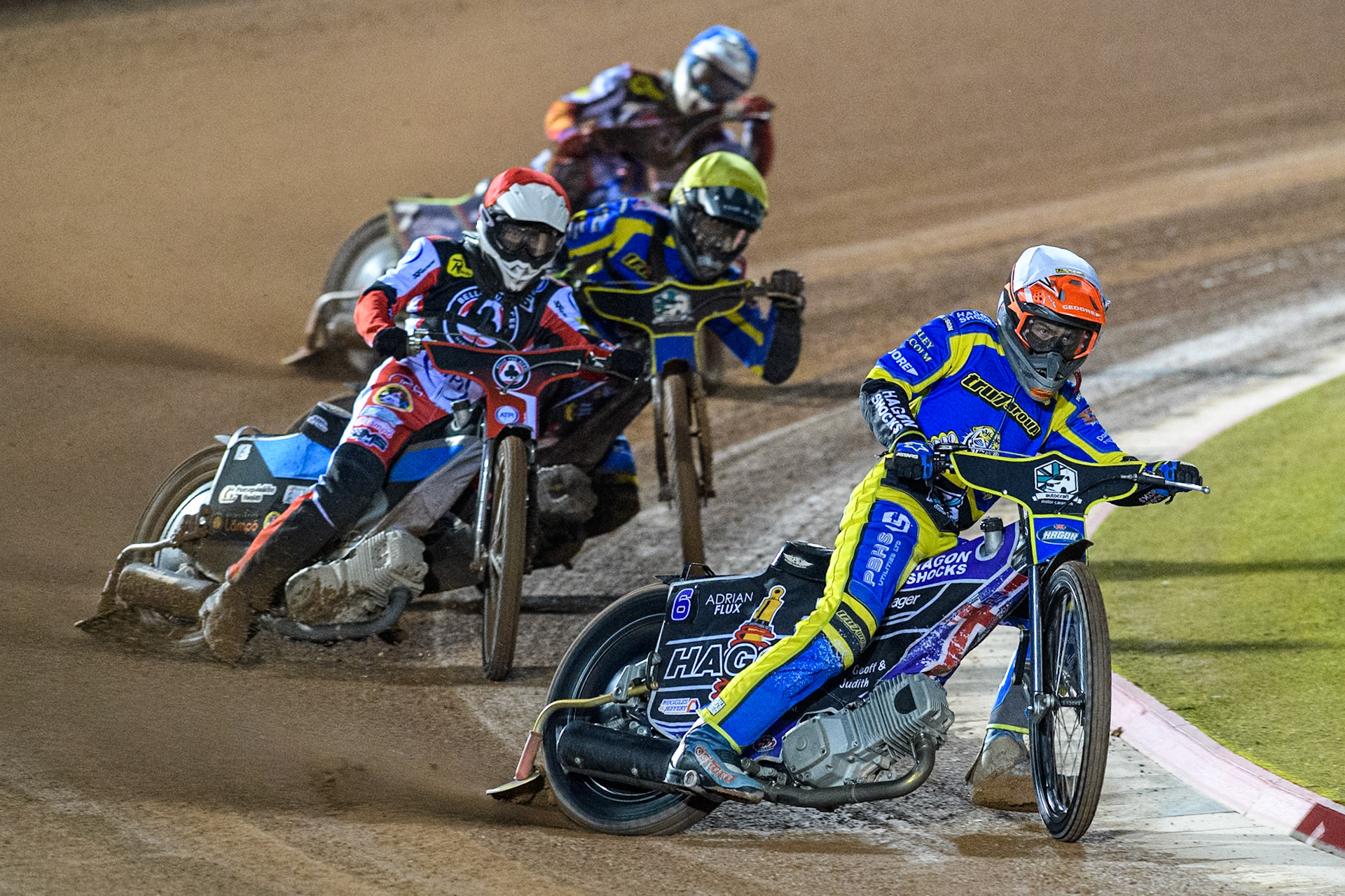Sheffield Tigers' Jason Edwards  in White leading Belle Vue Aces' Antti Vuolas  in Red, Sheffield Tigers' Dan Gilkes  in Yellow and Belle Vue Aces' Jake Mulford  in Blue during the Rowe Motor Oil Premiership Play Off Semi Final 2, 1st Leg match between Belle Vue Aces and Sheffield Tigers at the National Speedway Stadium, Manchester on Monday 16th September 2024. (Photo: Ian Charles | MI News)