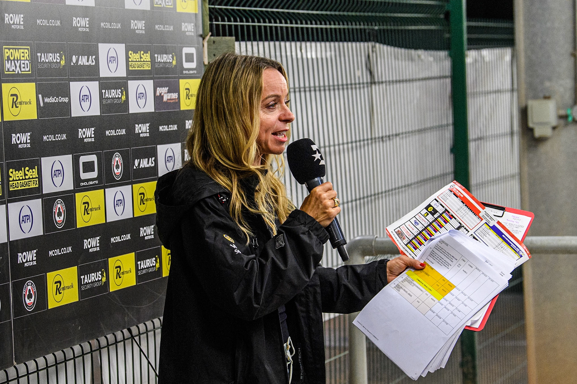 Eurosport presenter Abi Stephens does a piece to Camera during the Rowe Motor Oil Premiership match between Belle Vue Aces and King's Lynn Stars at the National Speedway Stadium, Manchester on Monday 12th August 2024. (Photo: Ian Charles | MI News)