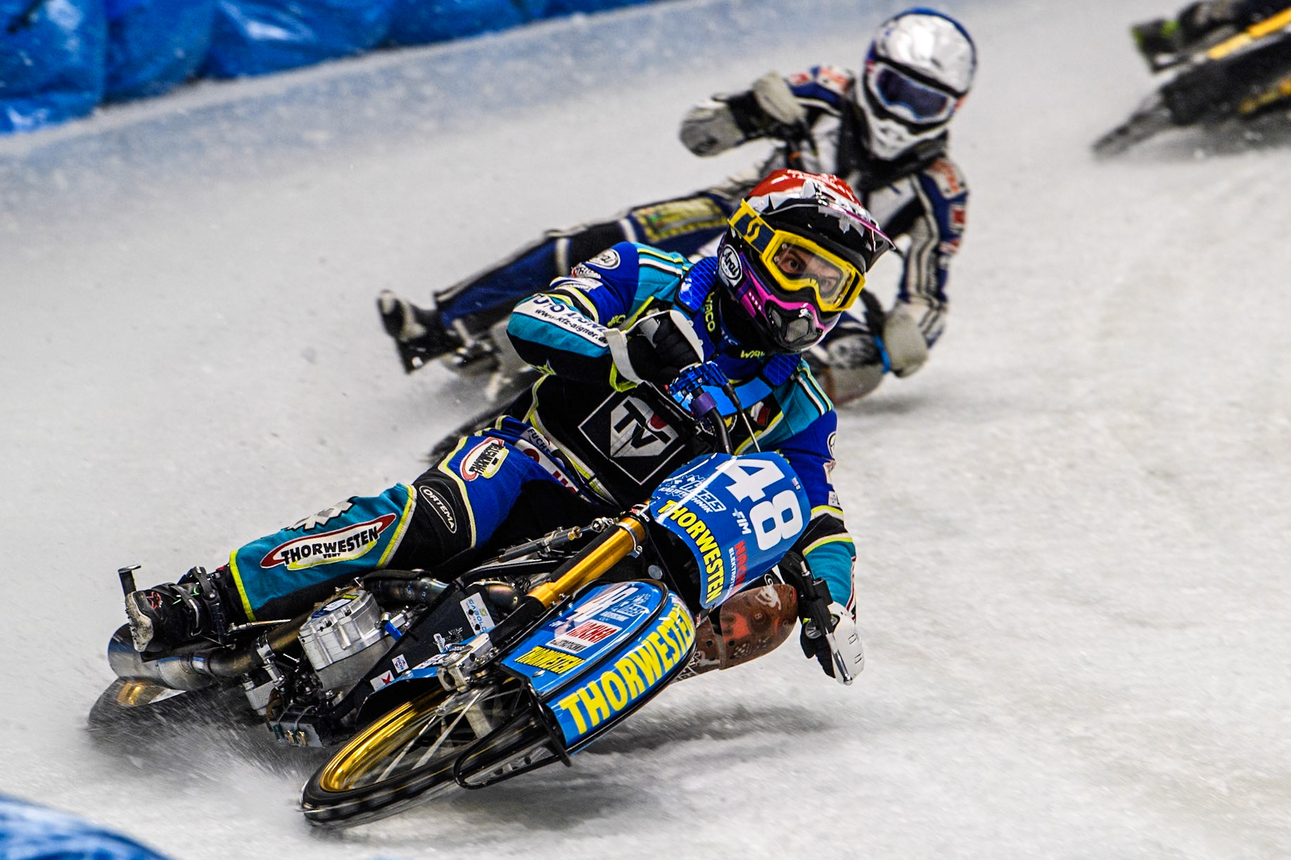 Luca Bauer (48) of Germany in Red leading Max Koivula (24) of Finland in Blue during the Ice Speedway Gladiators World Championship Final 1 at Max-Aicher-Arena, Inzell on Saturday 15th March 2025. (Photo: Ian Charles | MI News)