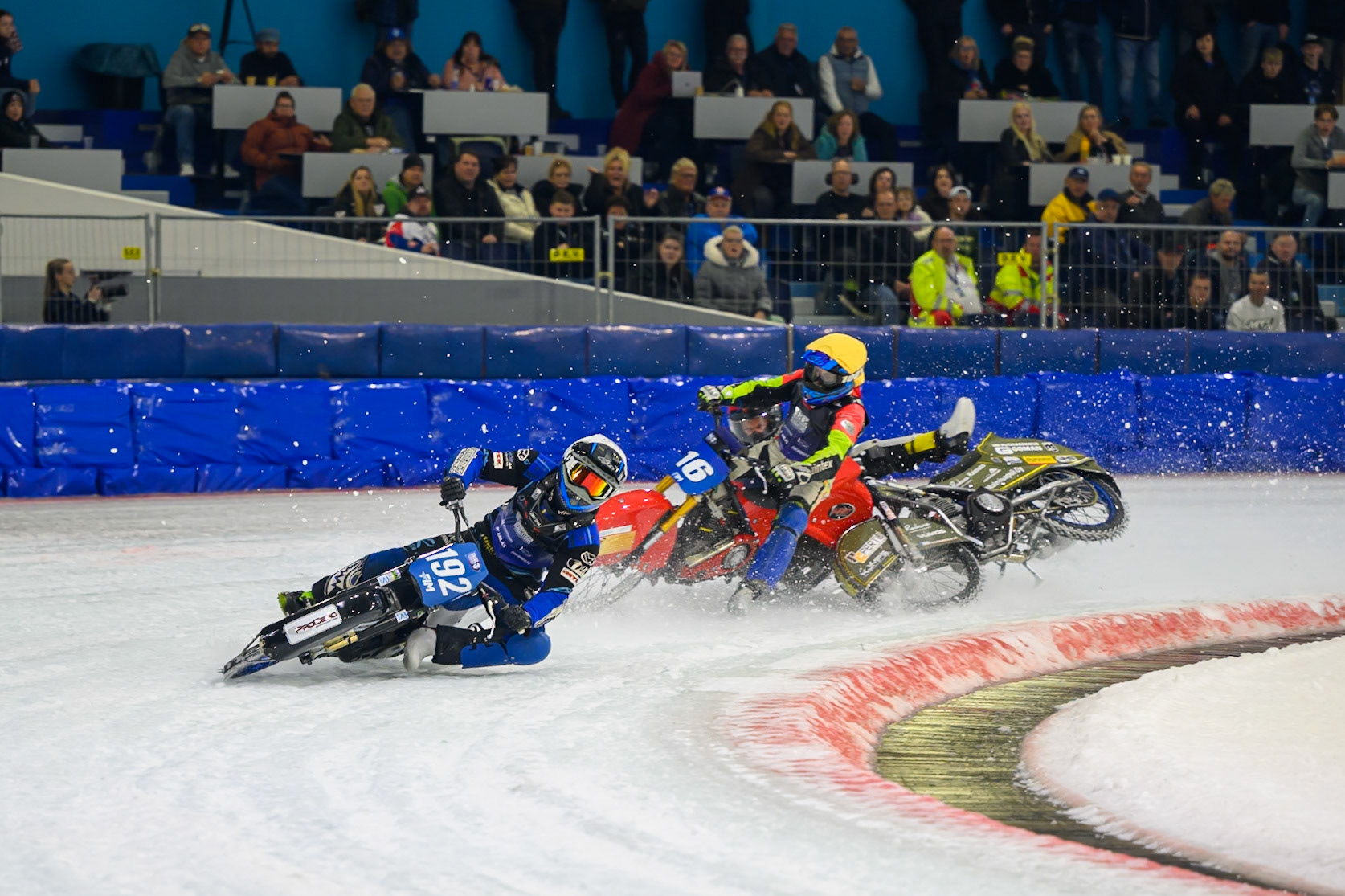 Heikki Huusko (67) of Finland  collides with Wild Card Harald Simon (16) of Austria in Yellow in the first turn during the FIM Ice Speedway Gladiators World Championship Final 3 at Ice Rink Thialf, Heerenveen on Saturday 11th April 2026. (Photo: Ian Charles | MI News)
