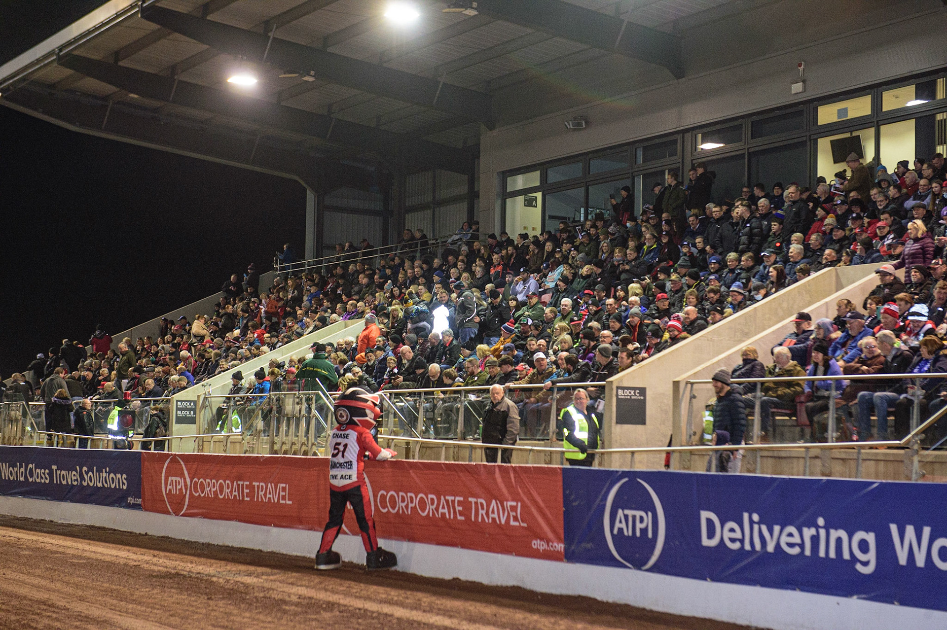MANCHESTER, UK. MAR 21ST. Aces’ mascot Chase The Ace warms up the full grandstand during the ATPI Peter Craven Memorial Trophy at the National Speedway Stadium, Manchester on Monday 21st March 2022. (Credit: Ian Charles | MI News)