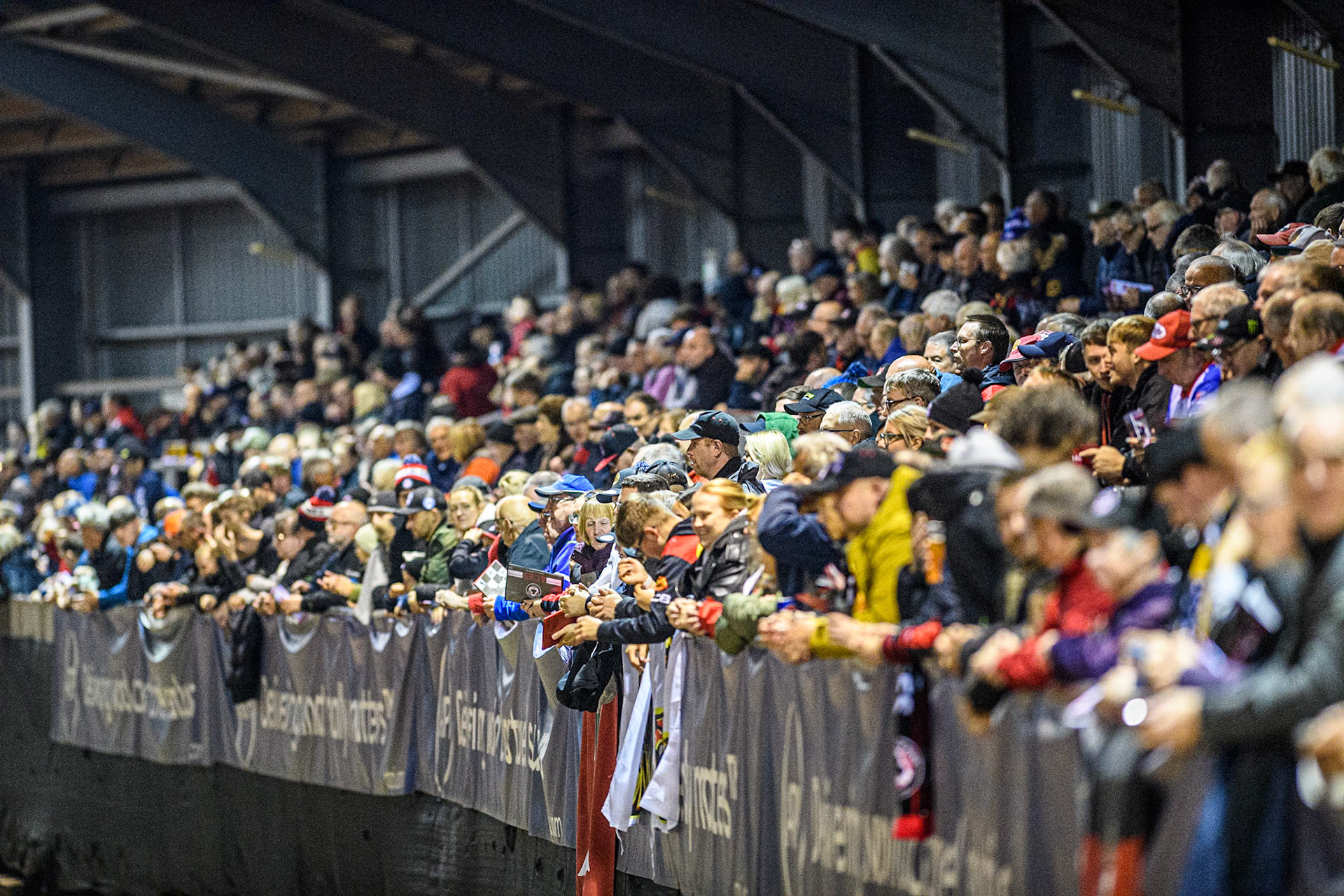 A big crowd in the National Speedway Stadium South Stand during the Rowe Motor Oil Premiership Grand Final 1st Leg between Belle Vue Aces and Leicester Lions at the National Speedway Stadium, Manchester on Monday 23rd September 2024. (Photo: Ian Charles | MI News)