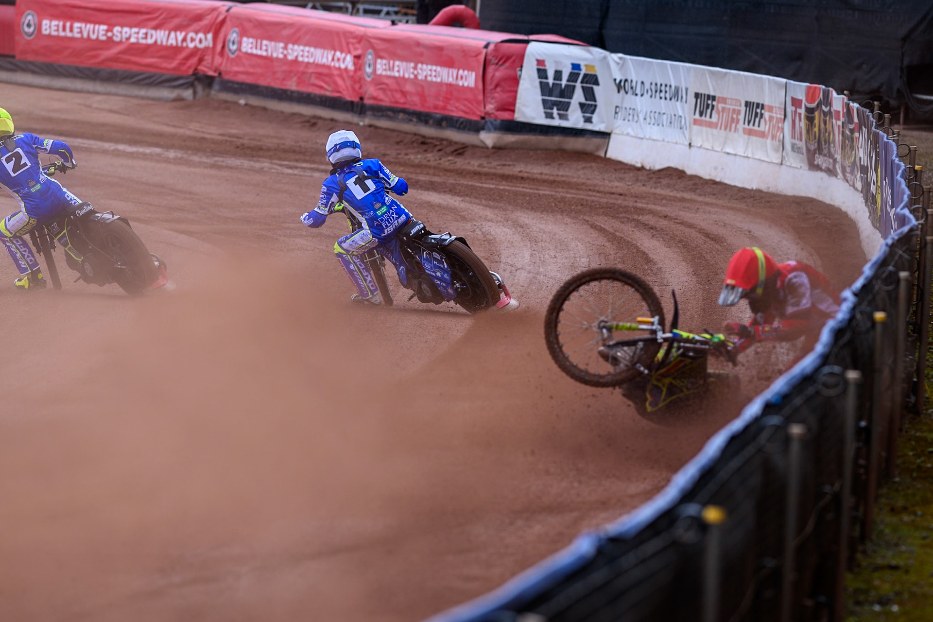 Belle Vue Colts' William Cairns falls whilst trying to pass Oxford Chargers' Jody Scott  in White and Oxford Chargers' Jacob Clouting  in Yellow during the WSRA National Development League match between Belle Vue Colts and Oxford Chargers at the National Speedway Stadium, Manchester on Sunday 1st June 2025. (Photo: Ian Charles | MI News)