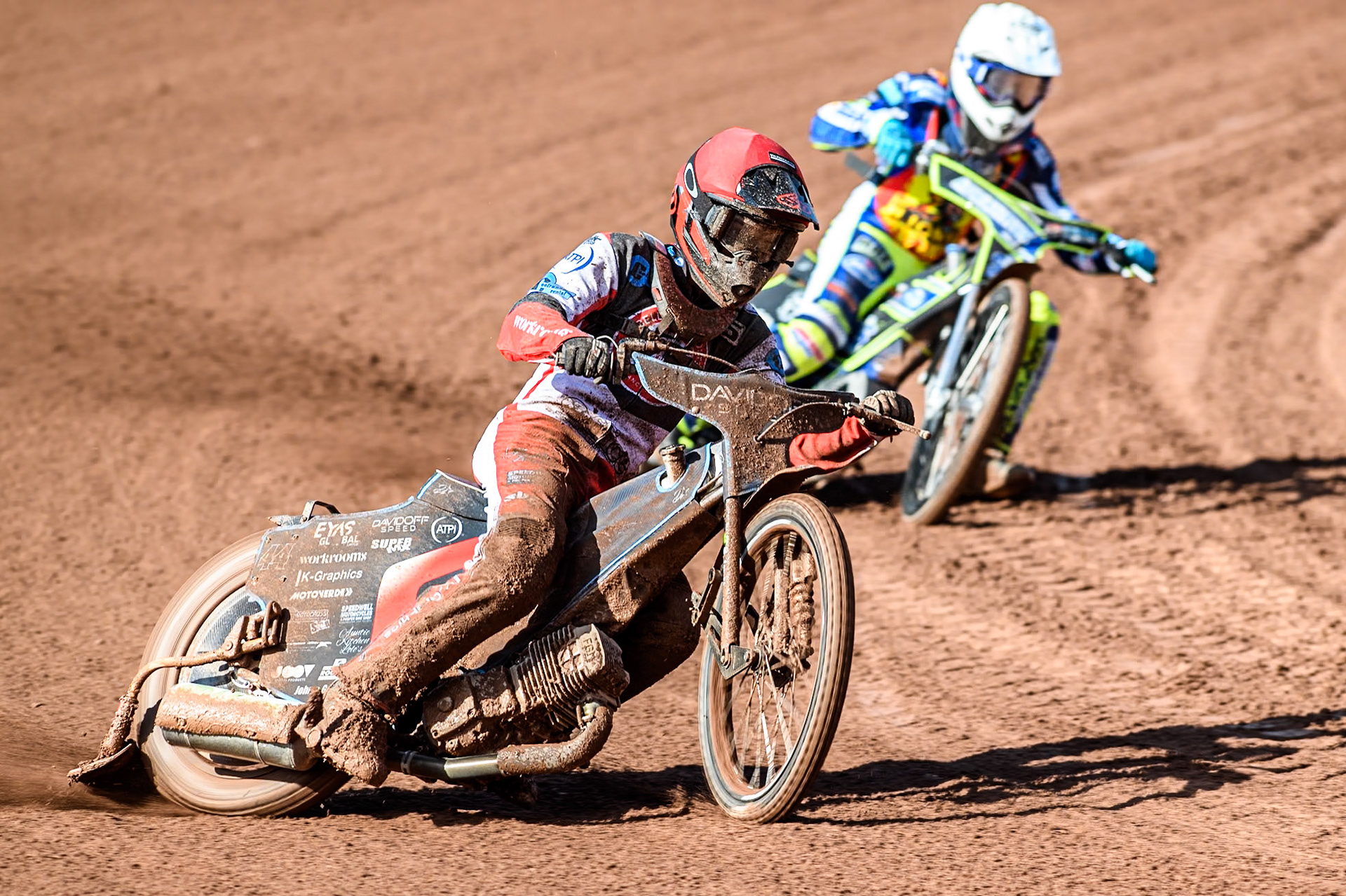 Belle Vue Colts' Freddy Hodder (Red) passes Leicester Lion Cubs' Jody Scott (White) during the WSRA  National Development League match between Belle Vue Colts and Leicester Lion Cubs at the National Speedway Stadium, Manchester on Friday 29th March 2024. (Photo: Ian Charles | MI News)