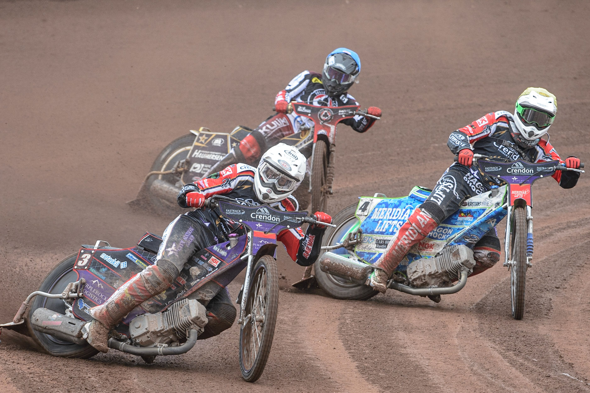 MANCHESTER, UK. MAY 2ND Ulrich Ostergaard  (White) and Hans Andersen   (Yellow) lead Norick Blödorn  (Blue) during the SGB Premiership match between Belle Vue Aces and Peterborough at the National Speedway Stadium, Manchester on Monday 2nd May 2022. (Credit: Ian Charles | MI News)