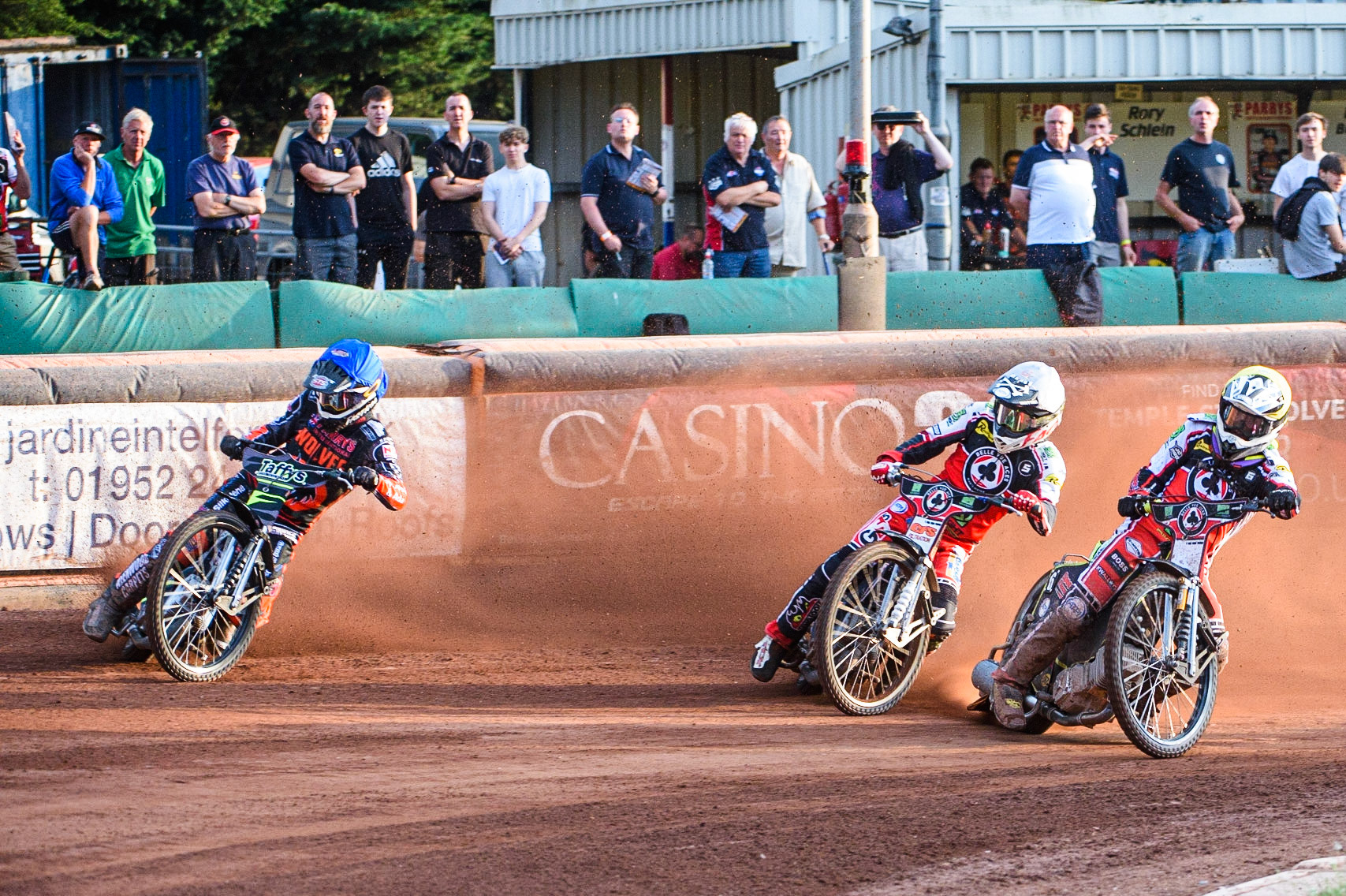 WOLVERHAMPTON, UK. JULY 26TH Tom Brennan  (Yellow) inside Dan Bewley  (White) and Leon Flint  (Blue) during the SGB Premiership match between Wolverhampton Wolves and Belle Vue Aces at the Ladbroke Stadium, Wolverhampton on Monday 26th July 2021. (Credit: Ian Charles | MI News)