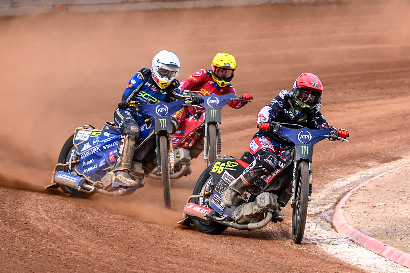 Fredrik Lindgren (66) of Sweden in Red leading Robert Lambert (505) of Great Britain in White and Max Fricke (46) of Australia in Yellow in the last chance qualifier 1 during the ATPI FIM Speedway Grand Prix Round 4 at the National Speedway Stadium, Manchester, on Friday 13th June 2025. (Photo: Ian Charles | MI News)