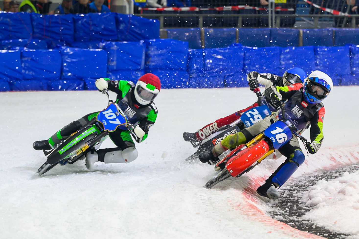 Wild Card Harald Simon (16) of Austria in White rides inside Andrej Divis (107) of Czechia in Red with Martin Posch (299) of Austria  in Blue behind during the FIM Ice Speedway Gladiators World Championship Final 3 at Ice Rink Thialf, Heerenveen on Saturday 11th April 2026. (Photo: Ian Charles | MI News)