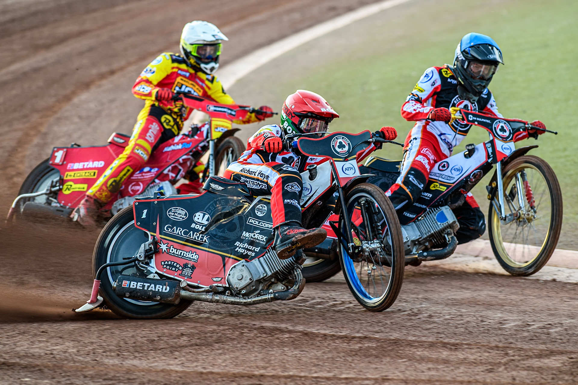 Belle Vue Aces' Brady Kurtz in Red rides outsideBelle Vue Aces' Norick Blodorn in Blue with Leicester Lions' Max Fricke in White behind during the Rowe Motor Oil Premiership match between Belle Vue Aces and Leicester Lions at the National Speedway Stadium, Manchester on Monday 19th May 2025. (Photo: Ian Charles | MI News)