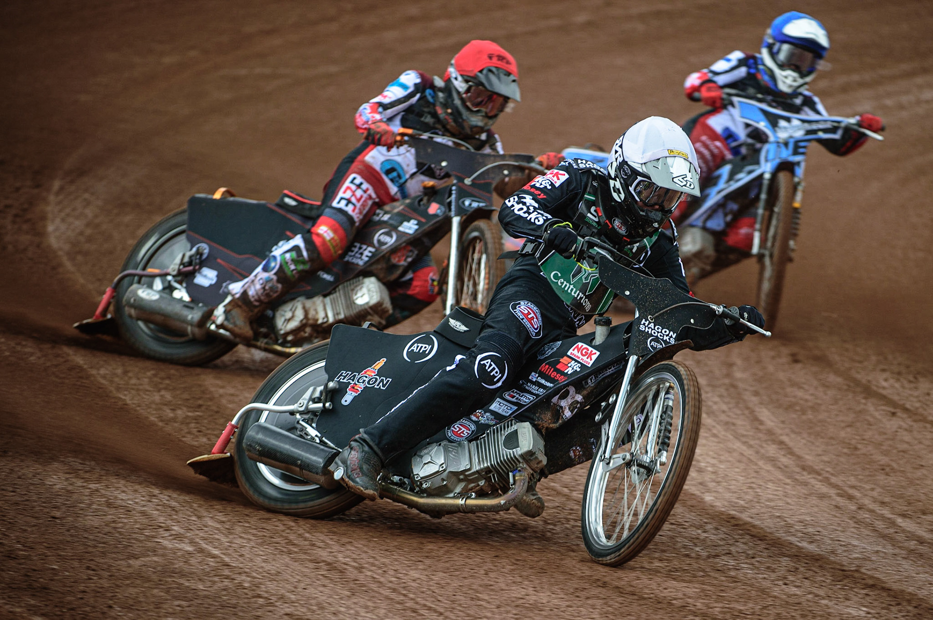 MANCHESTER, UK. APR 15TH  Dan Gilkes  (White) leads Jack Smith  (Red) and Sam McGurk  (Blue)  during the National Development League match between Belle Vue Colts and Plymouth Centurions at the National Speedway Stadium, Manchester on Friday 15th April 2022. (Credit: Ian Charles | MI News)