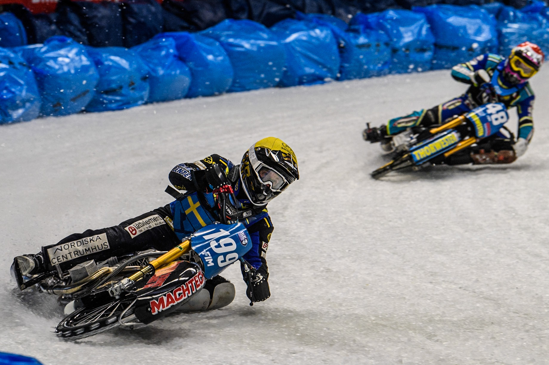 Martin Haarahiltunen (199) of Sweden in Yellow leading Luca Bauer (48) of Germany in Red during the Ice Speedway Gladiators World Championship Final 2 at Max-Aicher-Arena, Inzell on Sunday 16th March 2025. (Photo: Ian Charles | MI News)