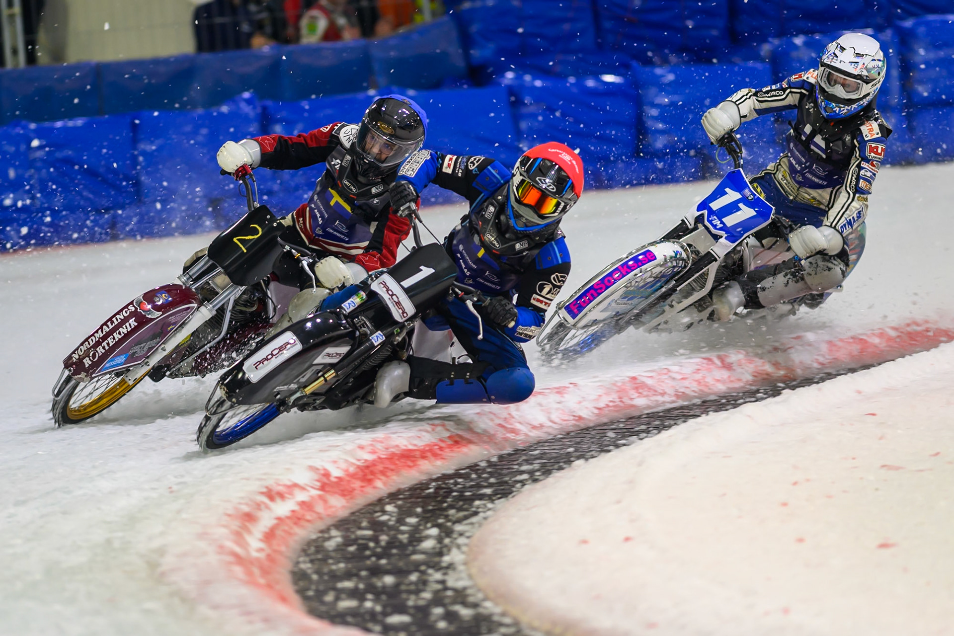 Niclas Svensson (1) of Sweden  in Red and Ove Ledstrom (2) of Sweden  in Blue leading Max Koivula (11) of Finland  in White in the re-run of Heat 9 during the FIM Ice Speedway Of Nations at Ice Rink Thialf, Heerenveen on Sunday 12th April 2026. (Photo: Ian Charles | MI News)