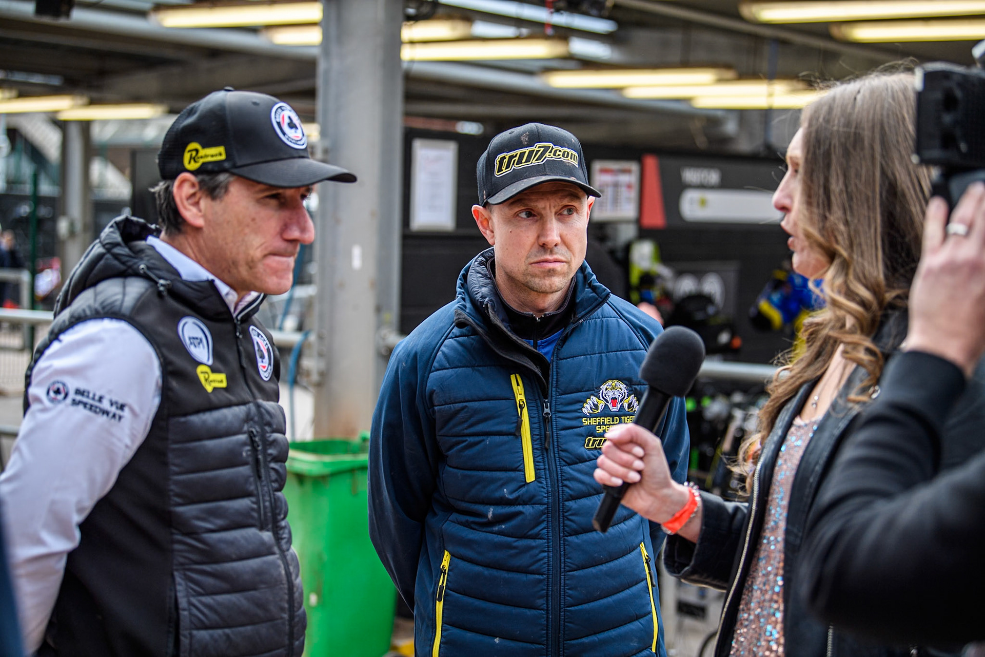 The BVTV crew interview Mark Lemon Team Manager of Belle Vue Aces (Left) and Simon Stead, Team Manager of Sheffield Tigers (Centre) during the Rowe Motor Oil Premiership match between Belle Vue Aces and Sheffield Tigers at the National Speedway Stadium, Manchester on Monday 5th May 2025. (Photo: Ian Charles | MI News)