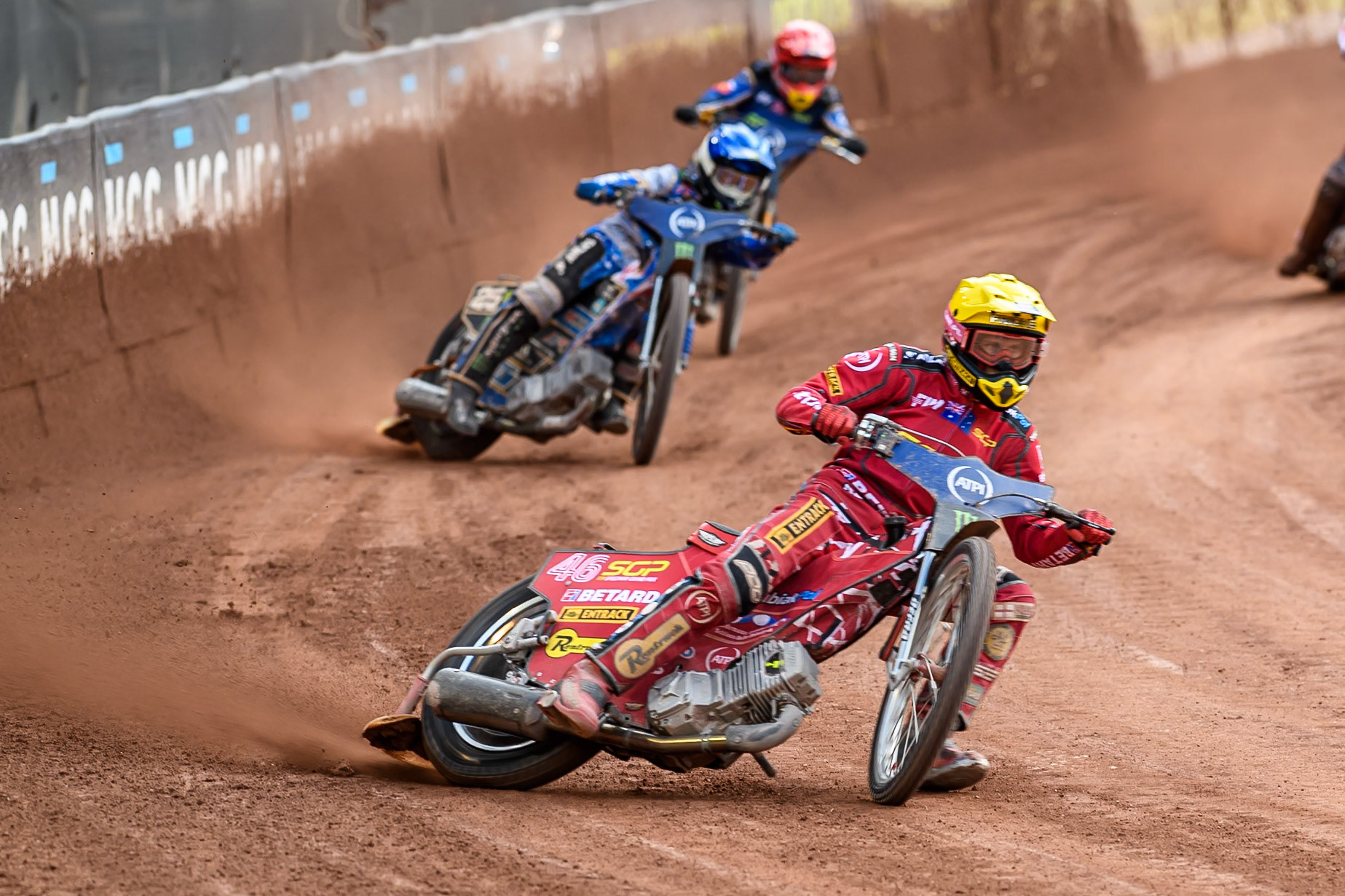 Max Fricke (46) of Australia in Yellow leading Jack Holder (25) of Australia in Blue and Robert Lambert (505) of Great Britain in Red during the ATPI FIM Speedway Grand Prix Round 4 at the National Speedway Stadium, Manchester, on Friday 13th June 2025. (Photo: Ian Charles | MI News)