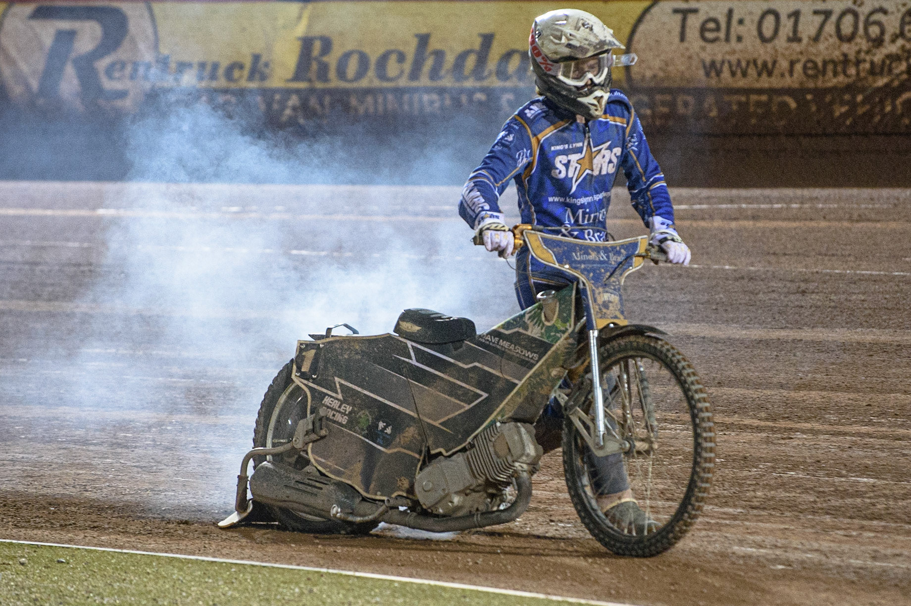 MANCHESTER, UK. AUGUST 23RD    Richard Lawson  pushes his bike bake back to the pits as his rear tyre had burst and was smoking  during the SGB Premiership match between Belle Vue Aces and King's Lynn Stars at the National Speedway Stadium, Manchester on Monday 23rd August 2021. (Credit: Ian Charles | MI News)