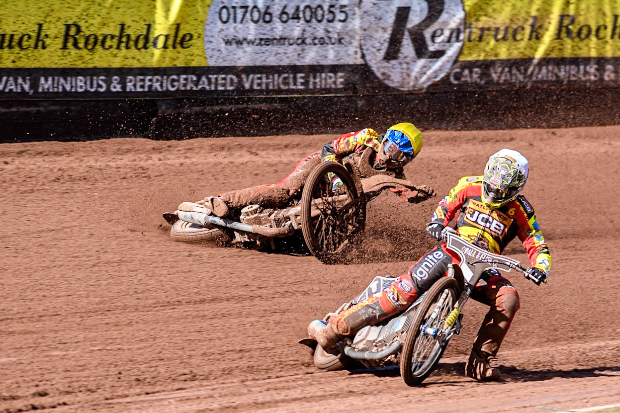 Leicester Lion Cubs' Sonny Springer  (Yellow) falls behind team mate Leicester Lion Cubs' Luke Crang (White) during the WSRA  National Development League match between Belle Vue Colts and Leicester Lion Cubs at the National Speedway Stadium, Manchester on Friday 29th March 2024. (Photo: Ian Charles | MI News)
