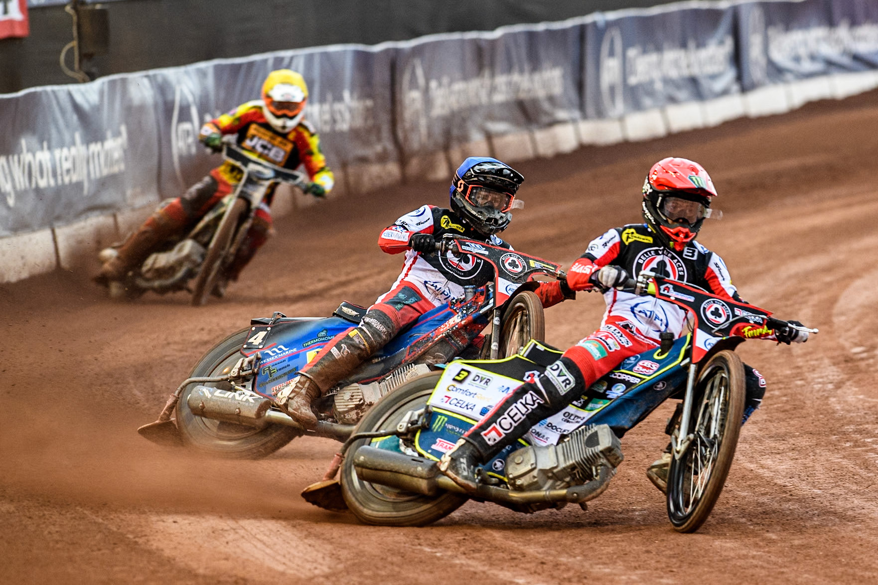 Belle Vue Aces' Jaimon Lidsey in Red leading team mate Belle Vue Aces' Ben Cook in Blue and Leicester Lions' Richard Lawson in Yellow during the Rowe Motor Oil Premiership match between Belle Vue Aces and Leicester Lions at the National Speedway Stadium, Manchester on Monday 24th June 2024. (Photo: Ian Charles | MI News)