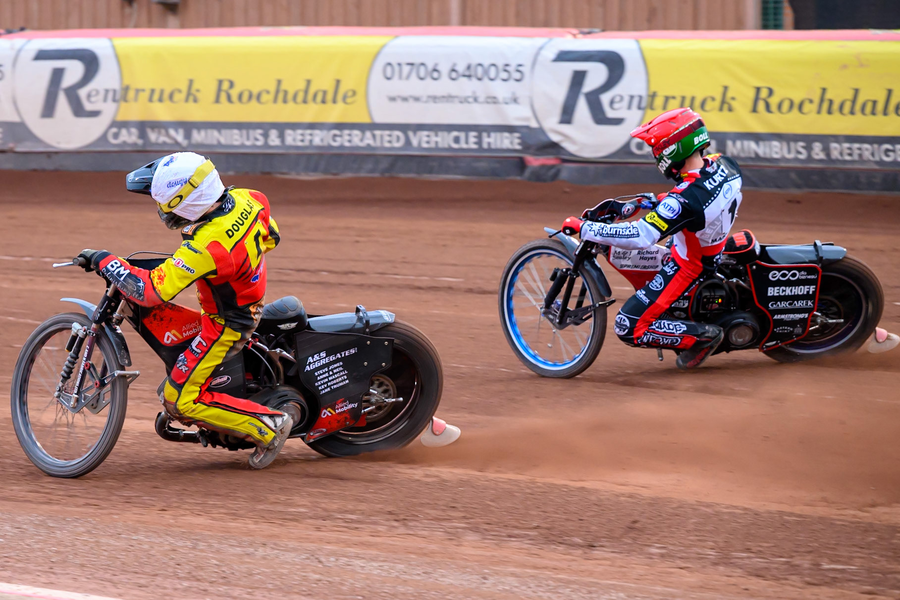 Ryan Douglas of Leicester Lions in White rides inside Brady Kurtz of Belle Vue Aces in Red during the Rowe Motor Oil Premiership match between Belle Vue Aces and Leicester Lions at the National Speedway Stadium, Manchester on Monday 15th June 2026. (Photo: Ian Charles | MI News)