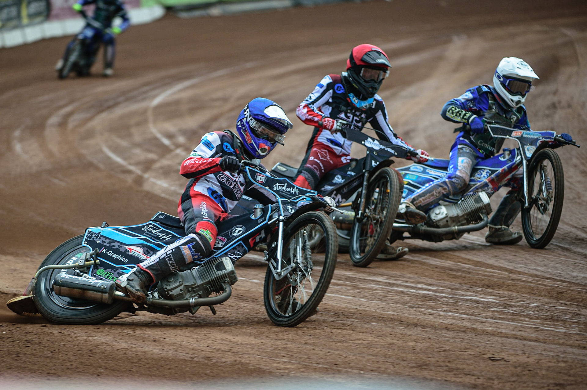 MANCHESTER, UK. APR 15TH   Freddy Hodder (Blue) outside Harry McGurk  (Red) and Jody Scott (White) during the National Development League match between Belle Vue Colts and Plymouth Centurions at the National Speedway Stadium, Manchester on Friday 15th April 2022. (Credit: Ian Charles | MI News)