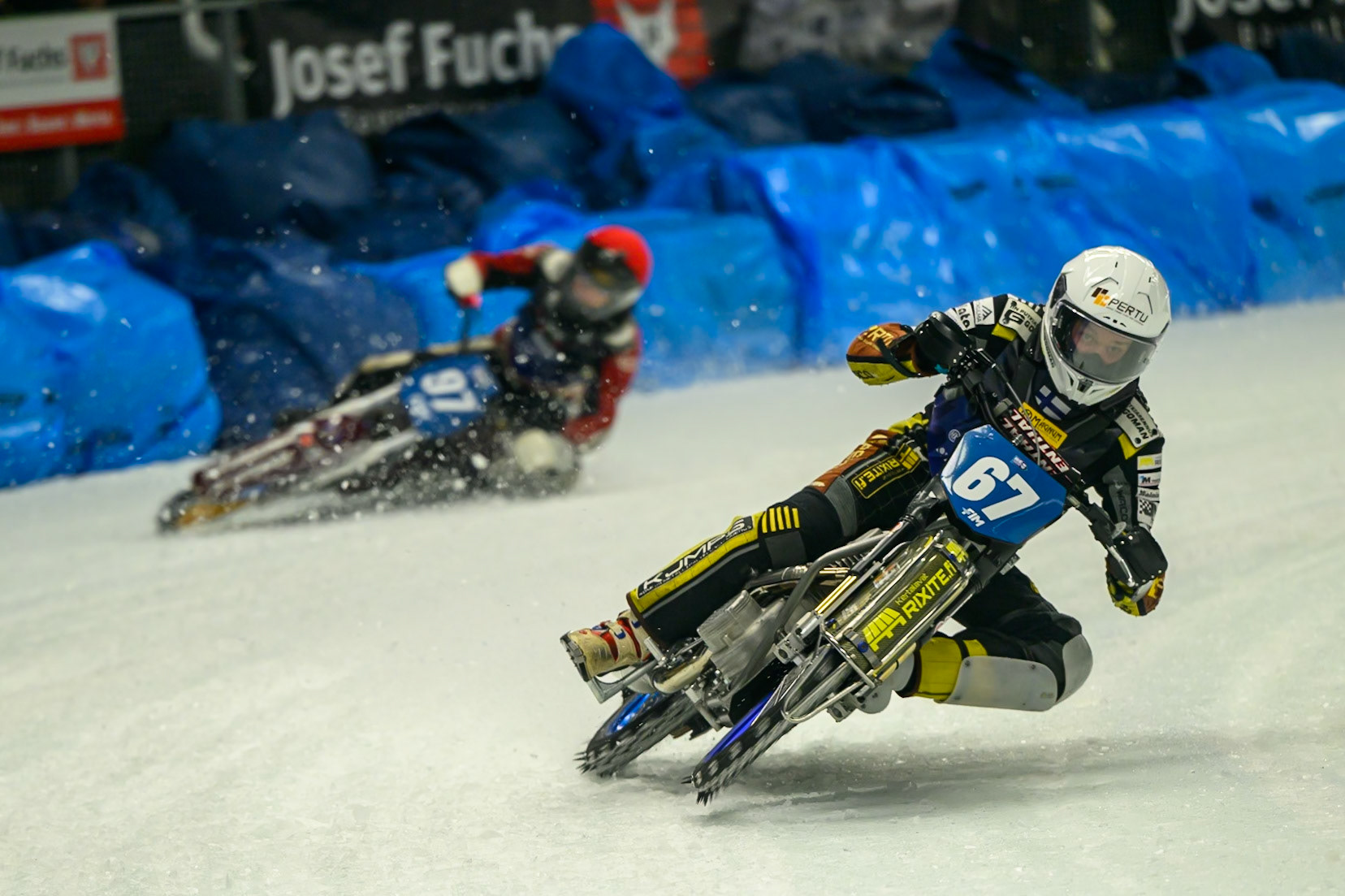 Heikki Huusko (67) of Finland  in White leading Ove Ledström (97) of Sweden  in Red during the Ice Speedway Gladiators World Championship Final 1 at Max-Aicher-Arena, Inzell on Saturday 14th March 2026. (Photo: Ian Charles | MI News)