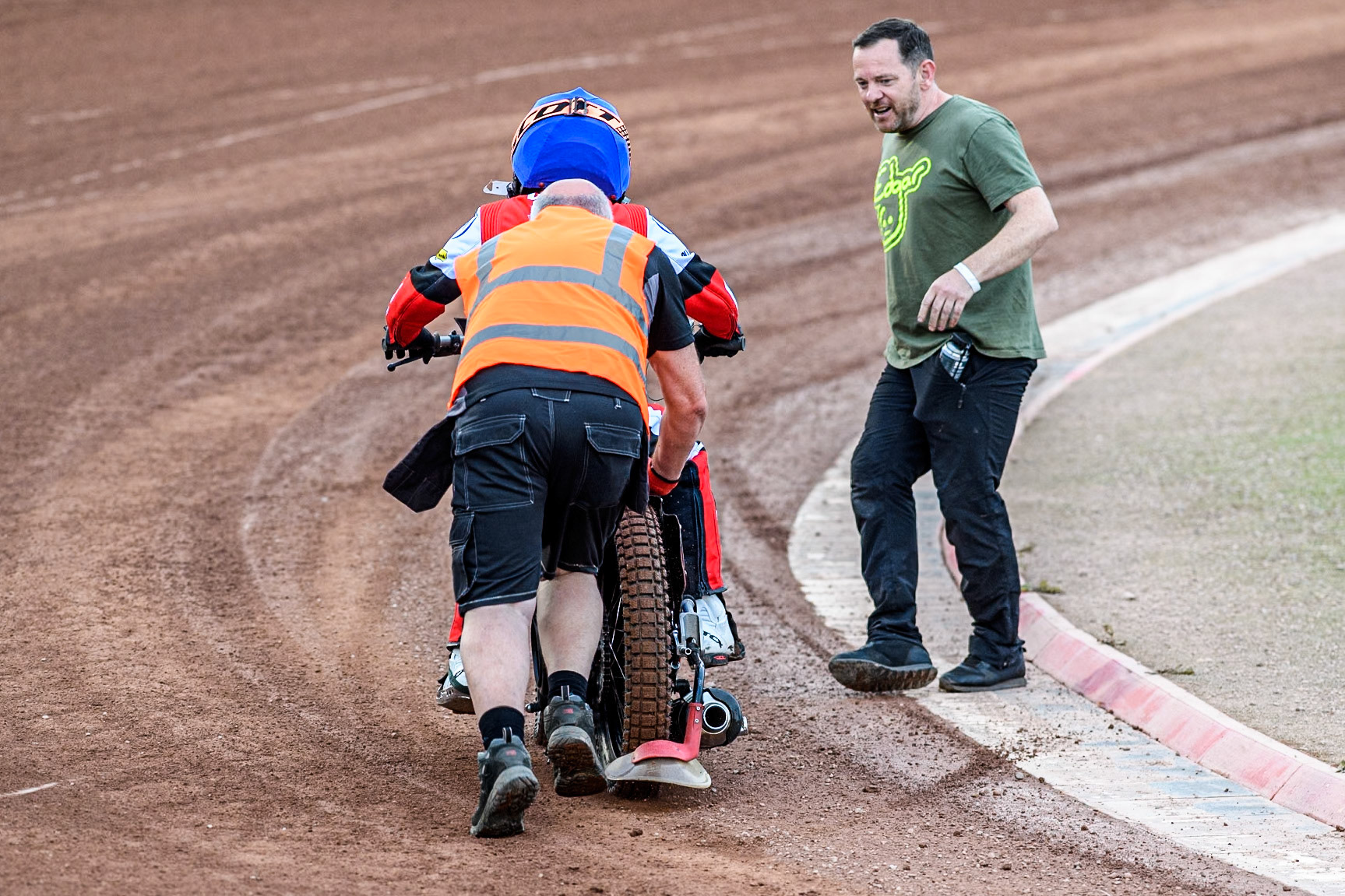 Belle Vue Aces' Ben Cook gets a push from a member of the track staff after stalling on leaving the pits during the Rowe Motor Oil Premiership match between Belle Vue Aces and Leicester Lions at the National Speedway Stadium, Manchester on Monday 24th June 2024. (Photo: Ian Charles | MI News)