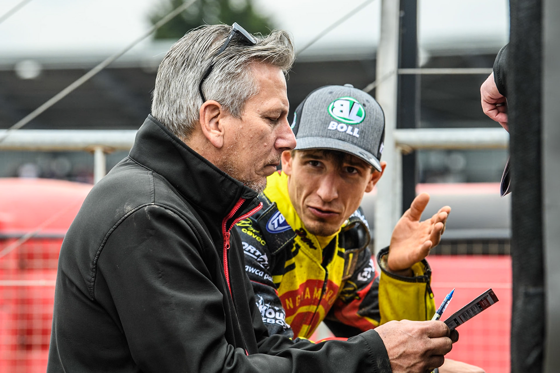 Birmingham Brummies' Piotr Pawlicki  (Right) chats with Birmingham Brummies' Team Manager Sam Ermolenko during the Rowe Motor Oil Premiership match between Belle Vue Aces and Birmingham Brummies at the National Speedway Stadium, Manchester on Monday 6th May 2024. (Photo: Ian Charles | MI News)