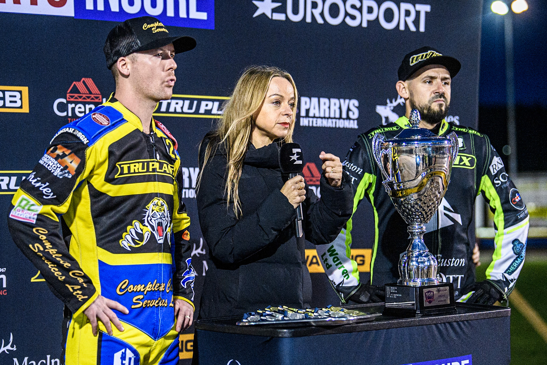 Eurosport presenter Abi Stephens (Centre) records the intro to the programme with Kyle Howarth (Left) and Danny King (Right) during the Sports Insure Premiership Grand Final Second Leg match between Sheffield Tigers and Ipswich Witches at Owlerton Stadium, Sheffield on Thursday 5th October 2023. (Photo: Ian Charles | MI News)