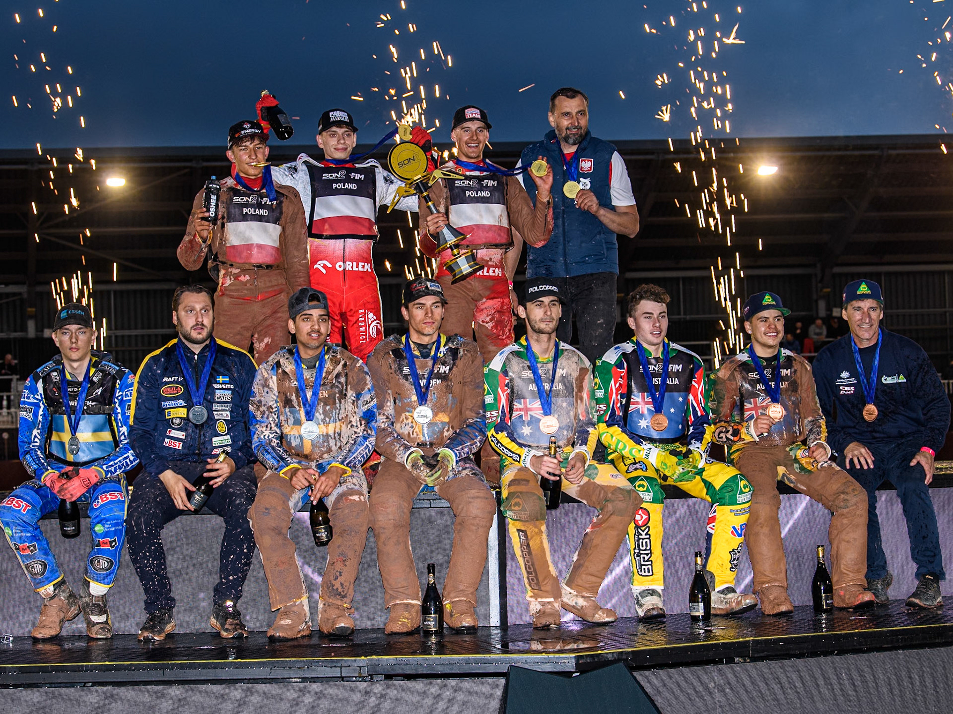 The top three teams: Rear: POLAND (Winners), Front: (Left) SWEDEN (2nd) and (Right) AUSTRALIA (3rd) during the Monster Energy FIM Speedway of Nations 2 (Under 21) Final at the National Speedway Stadium, Manchester on Friday 12th July 2024. (Photo: Ian Charles | MI News)