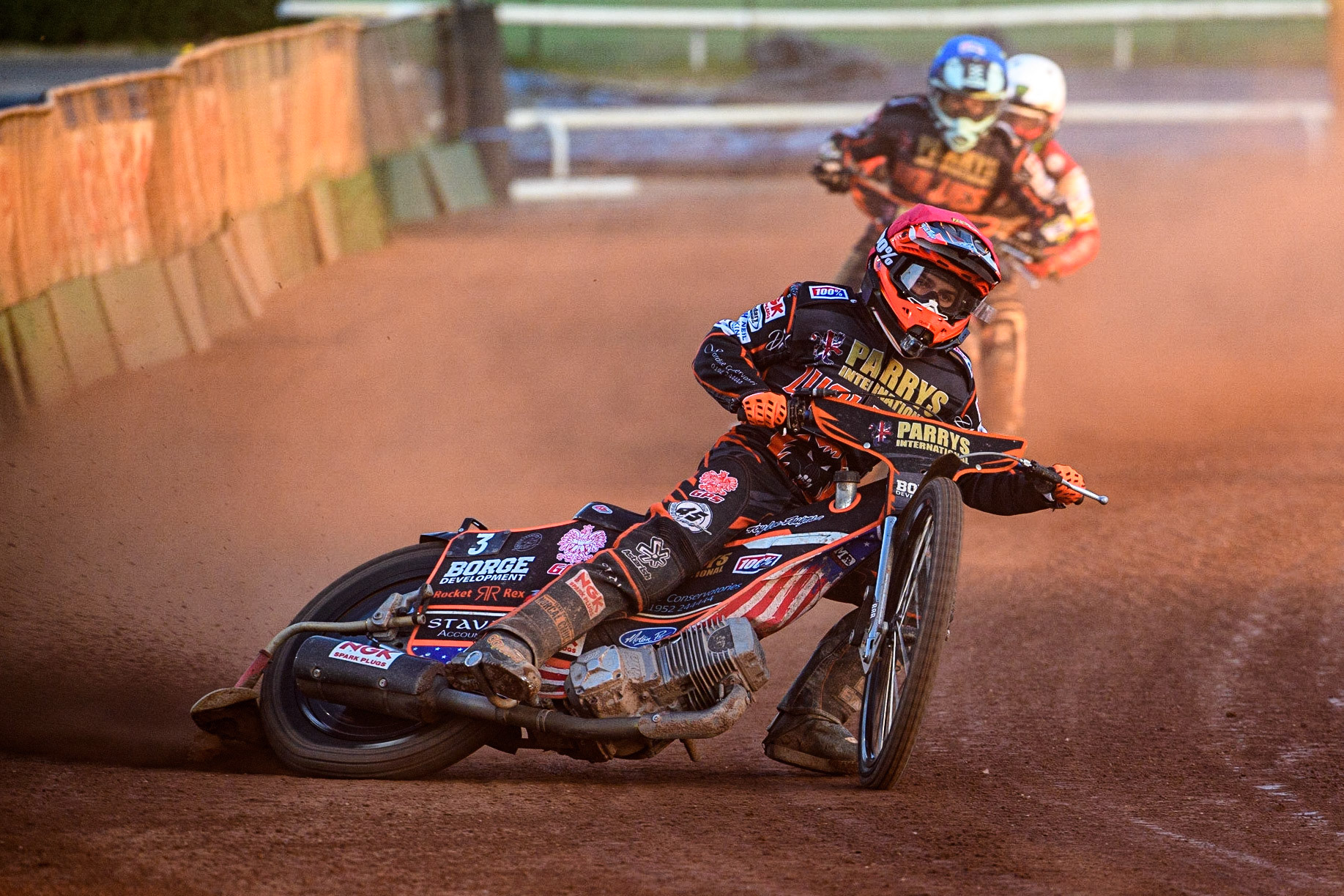 Luke Becker (Red) leads team mate Ryan Douglas (Blue) and Dan Bewley (White) during the Sports Insure Premiership match between Wolverhampton Wolves and Belle Vue Aces at Monmore Green Stadium, Wolverhampton on Monday 29th May 2023. (Photo: Ian Charles | MI News)