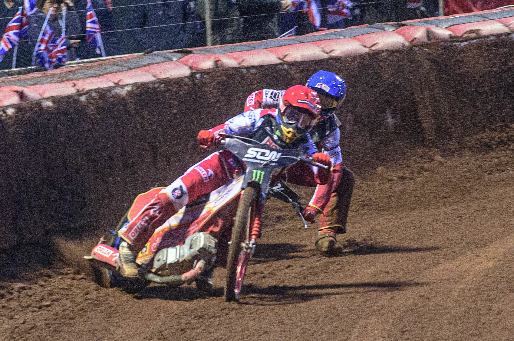 MANCHESTER, UK. OCT 17TH The moment Great Britain became champions as pl1(Red) causes team mate Maciej Janowski (Blue) to hit the dirt during the Monster Energy FIM Speedway of Nations at the National Speedway Stadium, Manchester on Sunday  17th October 2021. (Credit: Ian Charles | MI News)