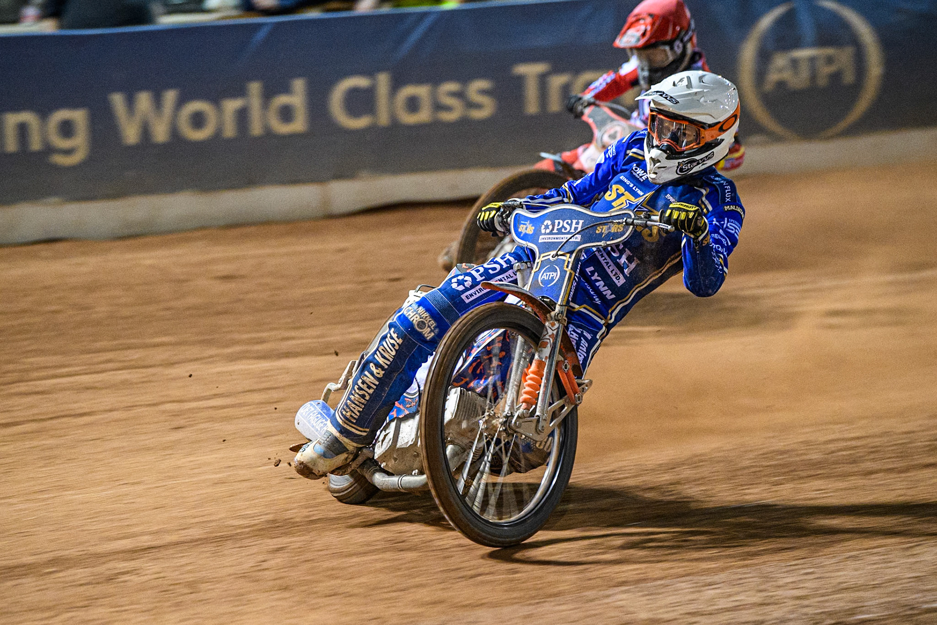 Niels-Kristian Iversen of Kings Lynn Stars in White leading Zach Cook of Belle Vue Aces in Red during the Rowe Motor Oil Premiership match between Belle Vue Aces and King's Lynn Stars at the National Speedway Stadium, Manchester on Monday 5th April 2025. (Photo: Ian Charles | MI News)