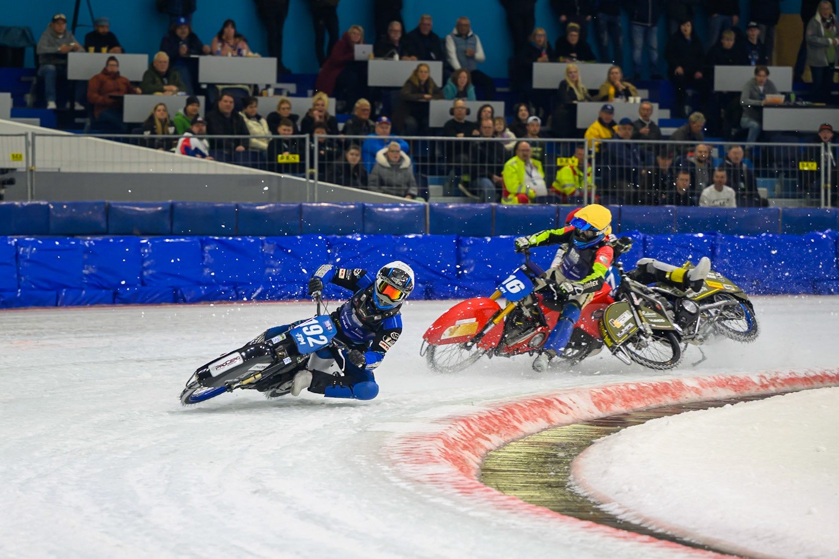 Heikki Huusko (67) of Finland  collides with Wild Card Harald Simon (16) of Austria in Yellow in the first turn during the FIM Ice Speedway Gladiators World Championship Final 3 at Ice Rink Thialf, Heerenveen on Saturday 11th April 2026. (Photo: Ian Charles | MI News)