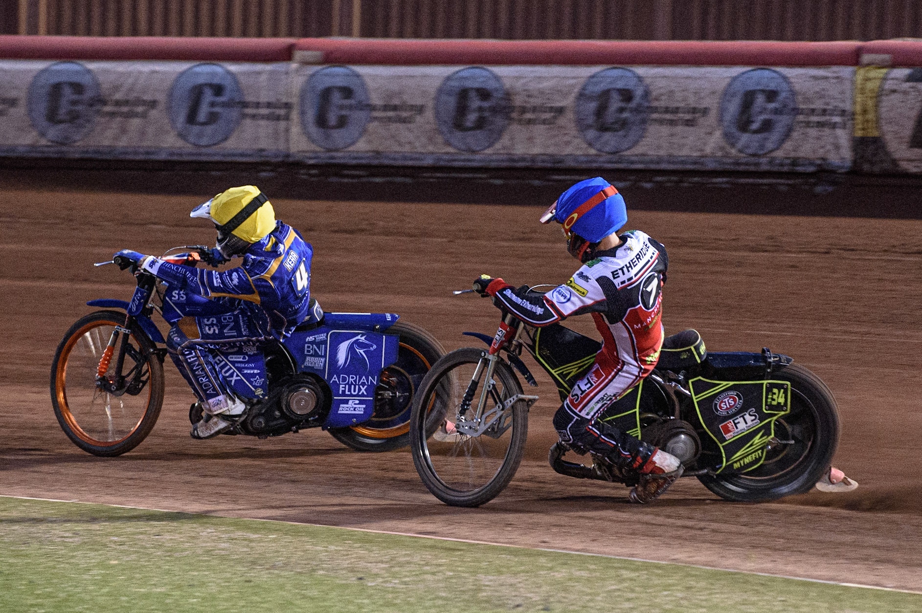 MANCHESTER, UK. AUGUST 23RD    Jye Etheridge  (Blue) chases Lewis Kerr   (Yellow) during the SGB Premiership match between Belle Vue Aces and King's Lynn Stars at the National Speedway Stadium, Manchester on Monday 23rd August 2021. (Credit: Ian Charles | MI News)