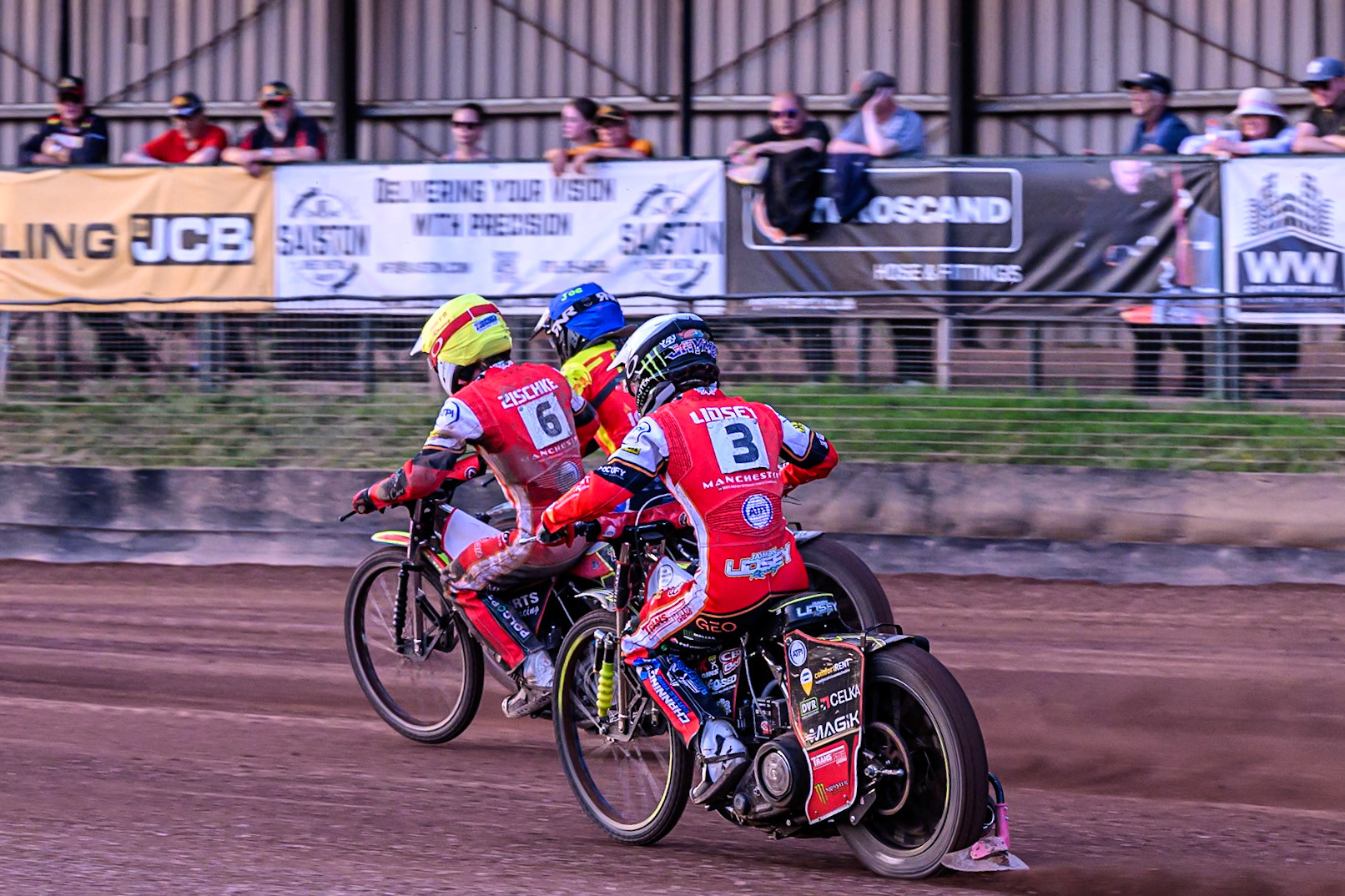 Belle Vue Aces' Jaimon Lidsey in White chases Belle Vue Aces' Tate Zischke in Yellow and Leicester Lions' Joe Thompson in Blue during the Rowe Motor Oil Premiership match between Leicester Lions and Belle Vue Aces at the Hydroscand Arena, Leicester on Thursday 19th June 2025. (Photo: Ian Charles | MI News)