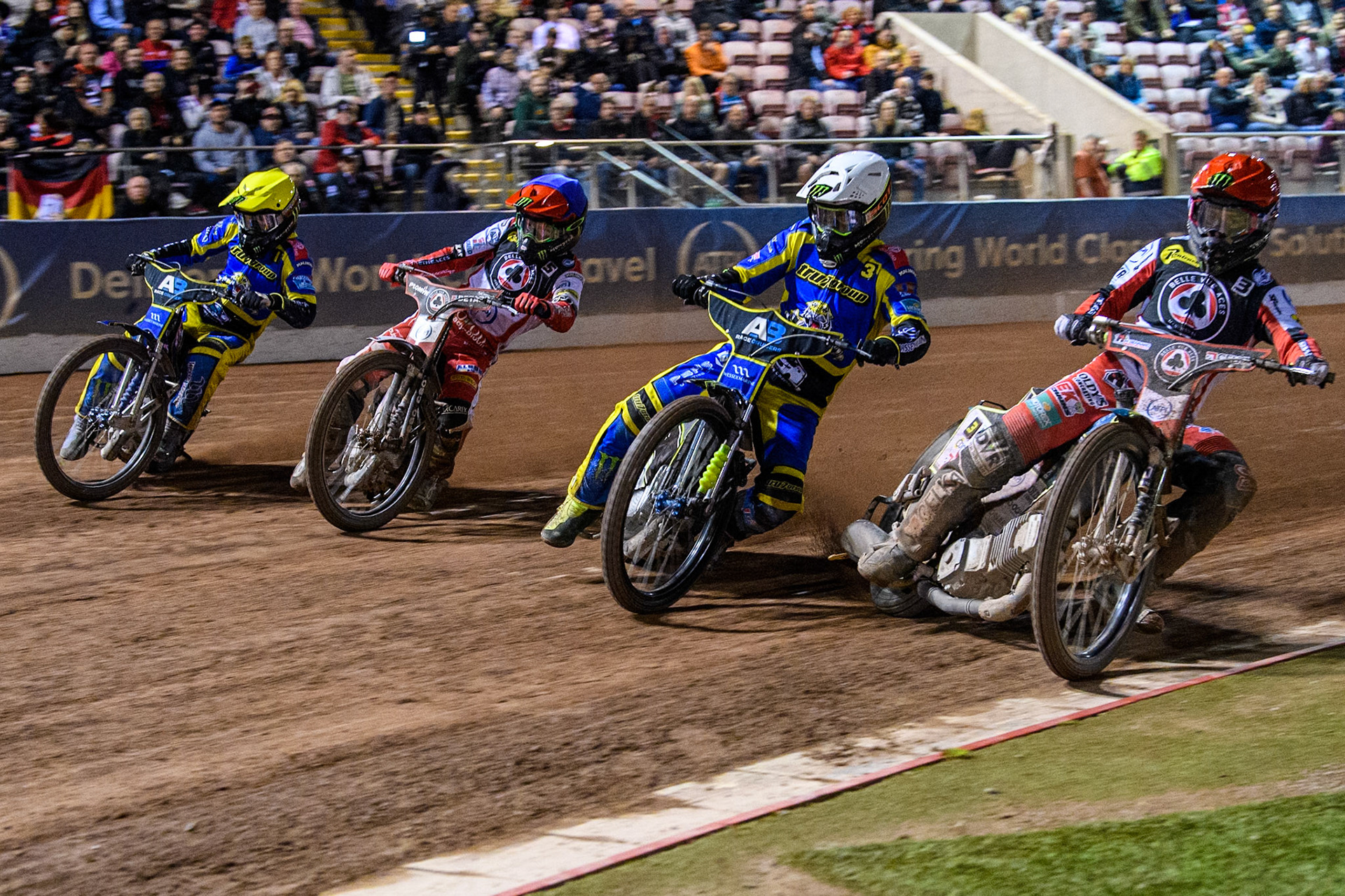 Belle Vue Aces' Jaimon Lidsey  in Red rides inside Sheffield Tigers' Chris Holder  in White, Belle Vue Aces' Dan Bewley  in Blue and Sheffield Tigers' Jack Holder  in Yellow during the Rowe Motor Oil Premiership Play Off Semi Final 2, 1st Leg match between Belle Vue Aces and Sheffield Tigers at the National Speedway Stadium, Manchester on Monday 16th September 2024. (Photo: Ian Charles | MI News)