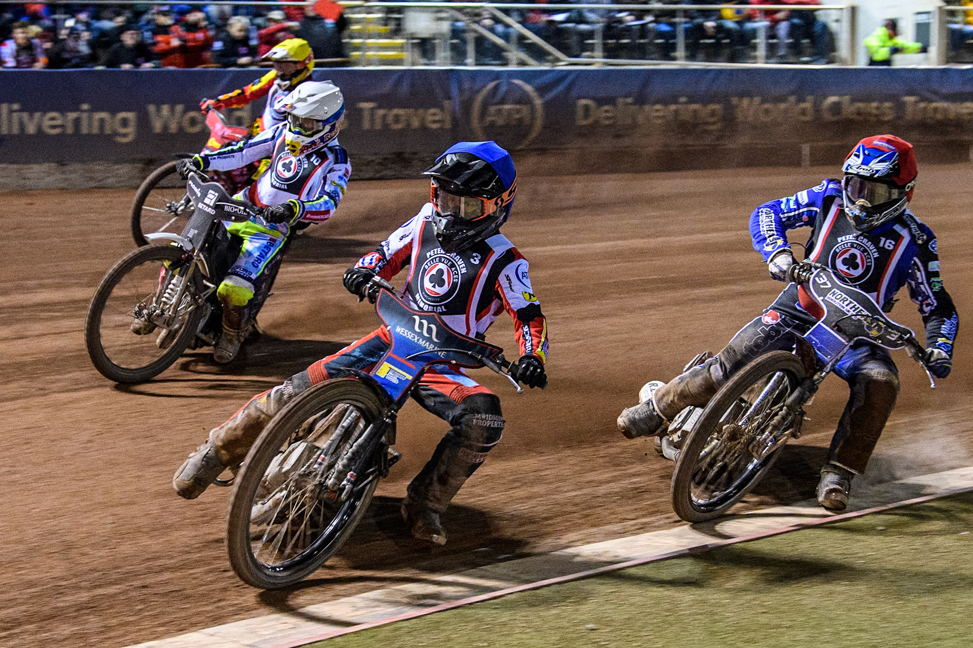 Australia's Ben Cook (Blue) leads  England's Chris Harris (Red) Poland’s Maceij Janowski (White) and Australia's Max Fricke (Yellow) during the Peter Craven Memorial Trophy meeting at the National Speedway Stadium, Manchester on Monday 18th March 2024. (Photo: Ian Charles | MI News)