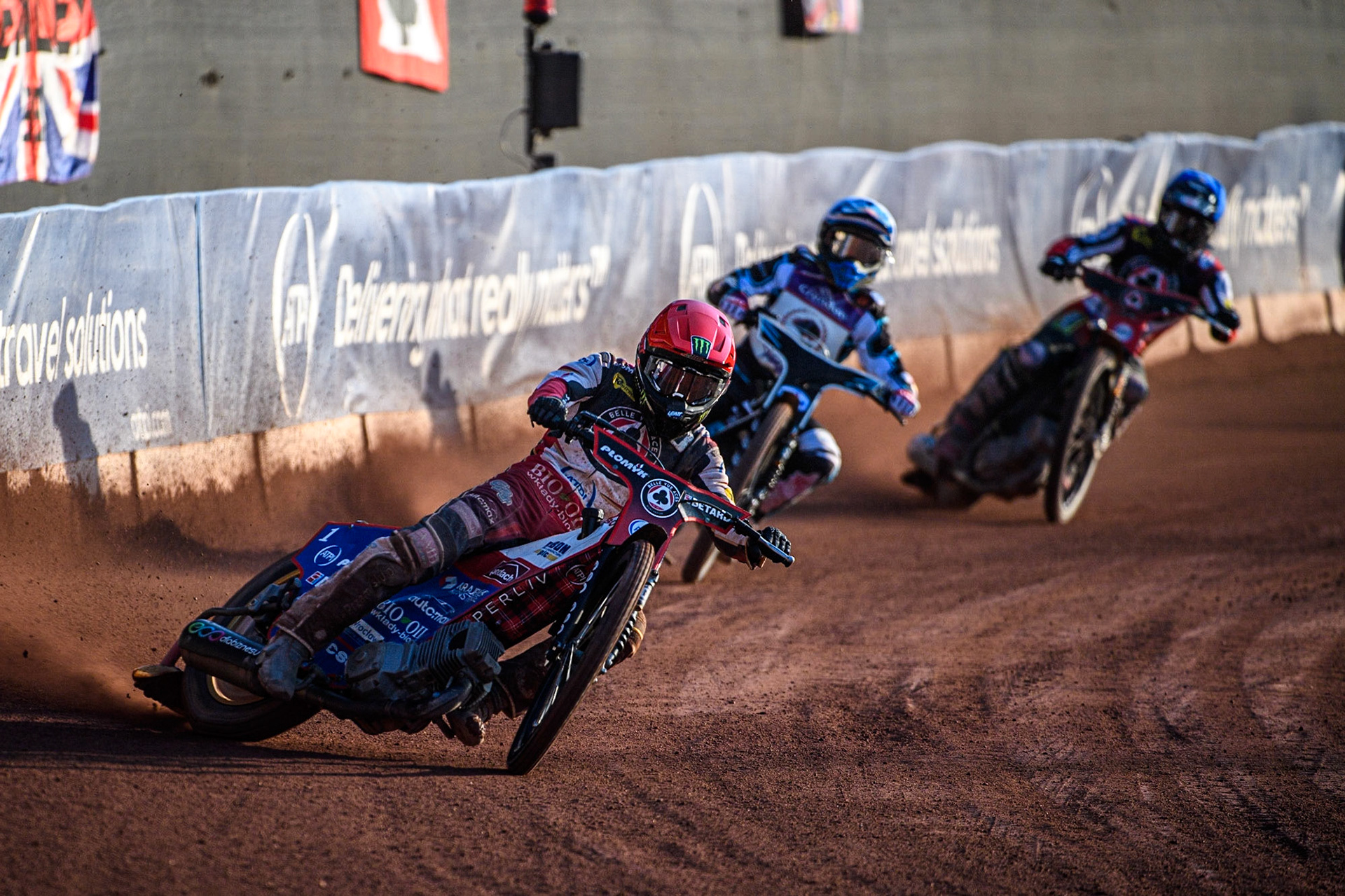 Dan Bewley (Red) leads Vadim Tarasenko (White) and Tom Brennan (Blue) during the Sports Insure Premiership match between Belle Vue Aces and Peterborough at the National Speedway Stadium, Manchester on Monday 19th June 2023. (Photo: Ian Charles | MI News)