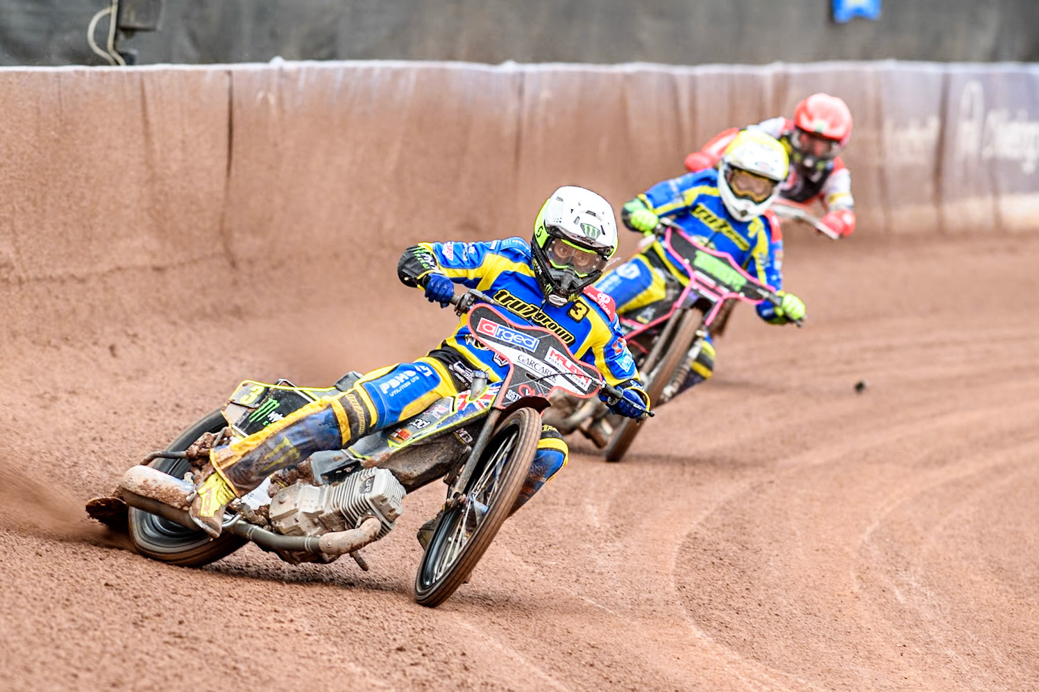 Sheffield Tigers' Chris Holder (White)leads  Sheffield Tigers' Josh Pickering (Yellow) and Belle Vue ATPI Aces Dan Bewley (Red) during the Rowe Motor Oil Premiership KO Cup Quarter Final 1st Leg between Belle Vue Aces and Sheffield Tigers at the National Speedway Stadium, Manchester on Monday 1st April 2024. (Photo: Ian Charles | MI News)