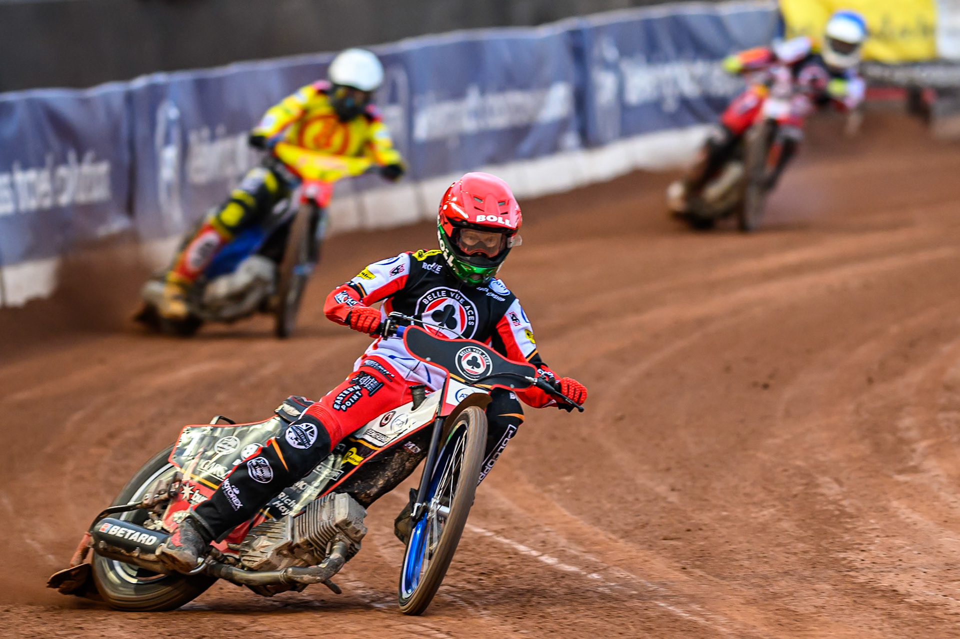 Belle Vue Aces' Brady Kurtz  in Red leading Birmingham Brummies' Tobias Musielak  in White and Belle Vue Aces' Jake Mulford  in Blue during the Rowe Motor Oil Premiership match between Belle Vue Aces and Birmingham Brummies at the National Speedway Stadium, Manchester on Monday 7th July 2025. (Photo: Ian Charles | MI News)