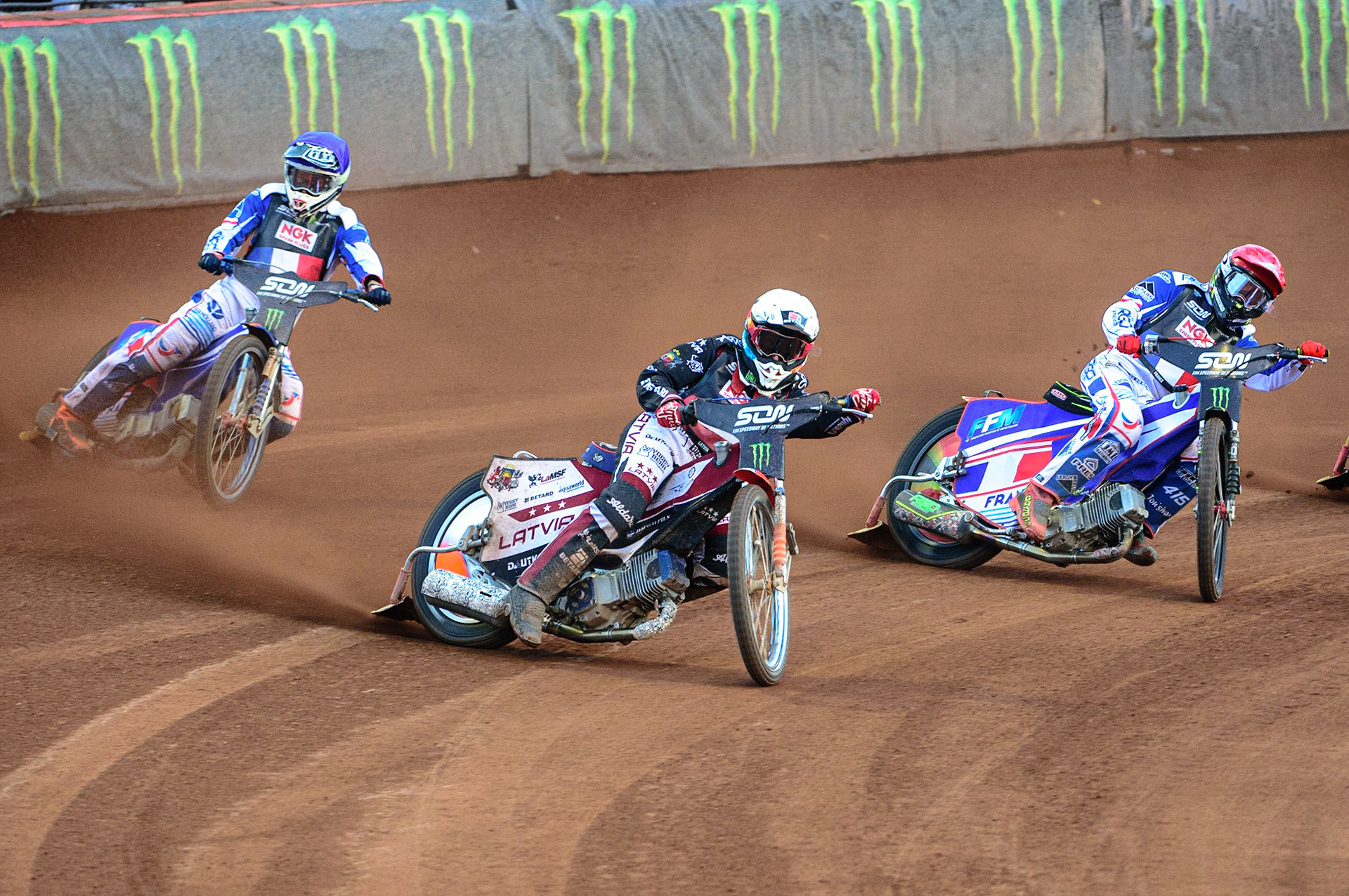 MANCHESTER, UK. OCT 16TH Andzejs Lebedevs of Latvia (White) leads David Bellego of France (Red) and Dmitri Berge of France (Blue) during the Monster Energy FIM Speedway of Nations at the National Speedway Stadium, Manchester on Saturday  16th October 2021. (Credit: Ian Charles | MI News)
