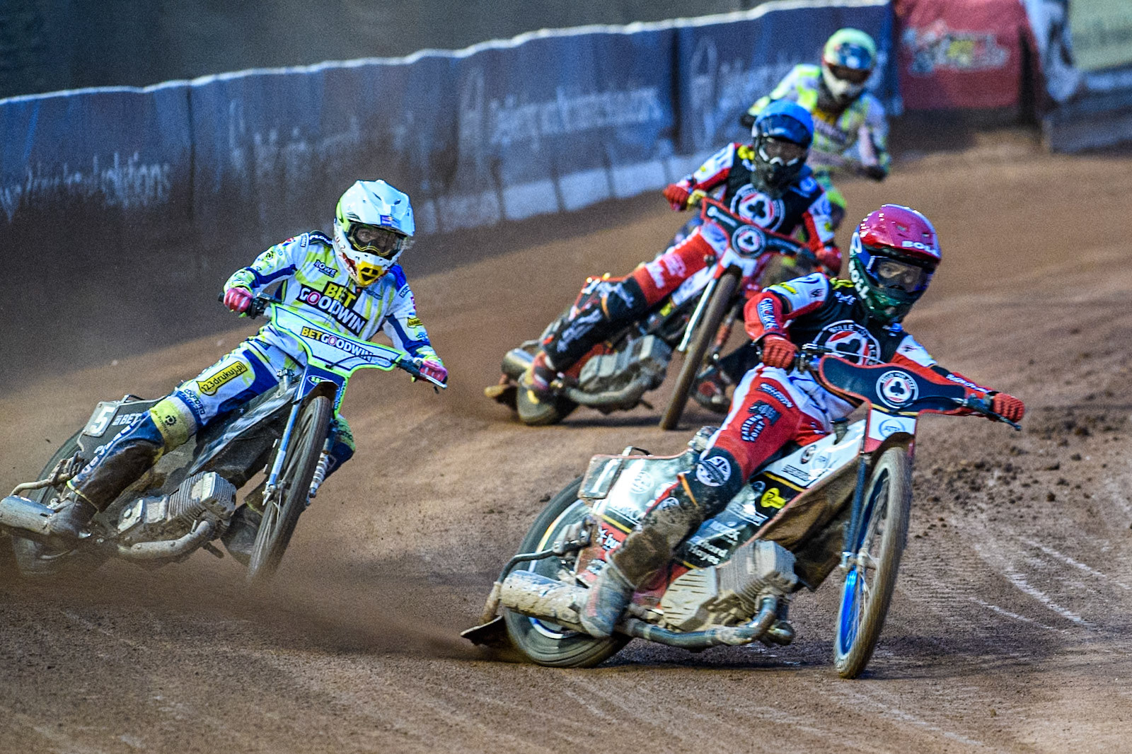 Belle Vue Aces' Brady Kurtz in Red leading Oxford Spires' Maciej Janowski in White, Belle Vue Aces' Norick Blodorn in Blue and Oxford Spires' Francis Gusts in Yellow during the Rowe Motor Oil Premiership match between Belle Vue Aces and Oxford Spires at the National Speedway Stadium, Manchester on Monday 14th April 2025. (Photo: Ian Charles | MI News)