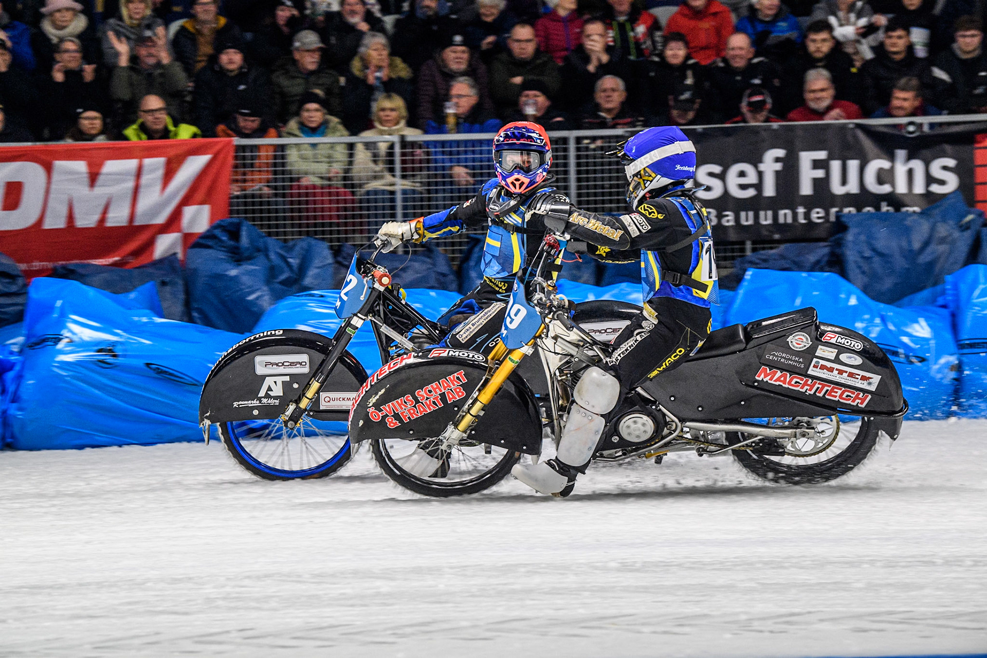 Martin Haarahiltunen (199) of Sweden in Blue congratulates Niclas Svensson (192) of Sweden after his win during the Ice Speedway Gladiators World Championship Final 1 at Max-Aicher-Arena, Inzell on Saturday 15th March 2025. (Photo: Ian Charles | MI News)