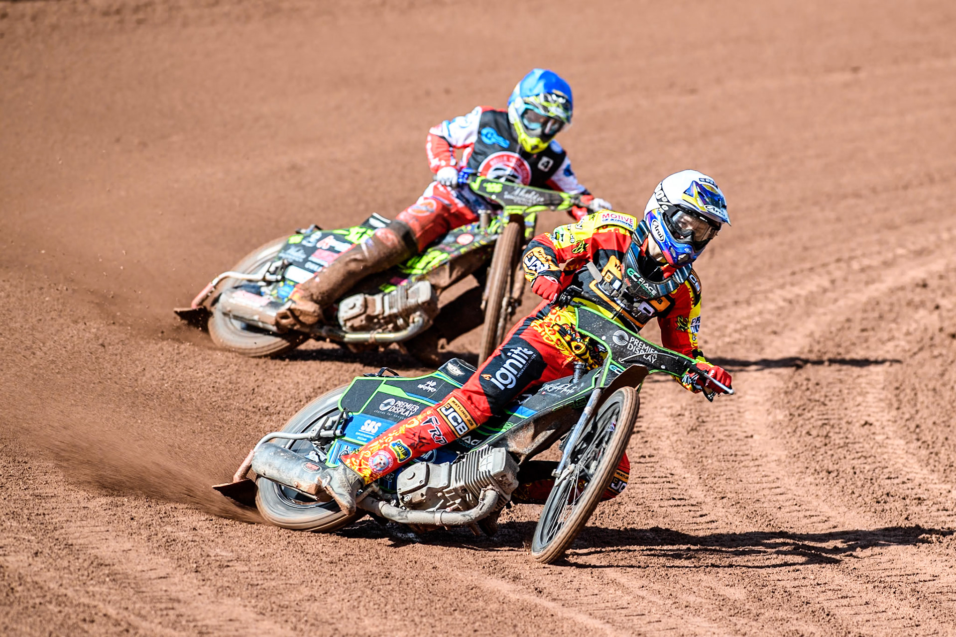 Leicester Lion Cubs' Tom Spencer (White) leads  Belle Vue Colts' Luke Muff (Blue) during the WSRA  National Development League match between Belle Vue Colts and Leicester Lion Cubs at the National Speedway Stadium, Manchester on Friday 29th March 2024. (Photo: Ian Charles | MI News)