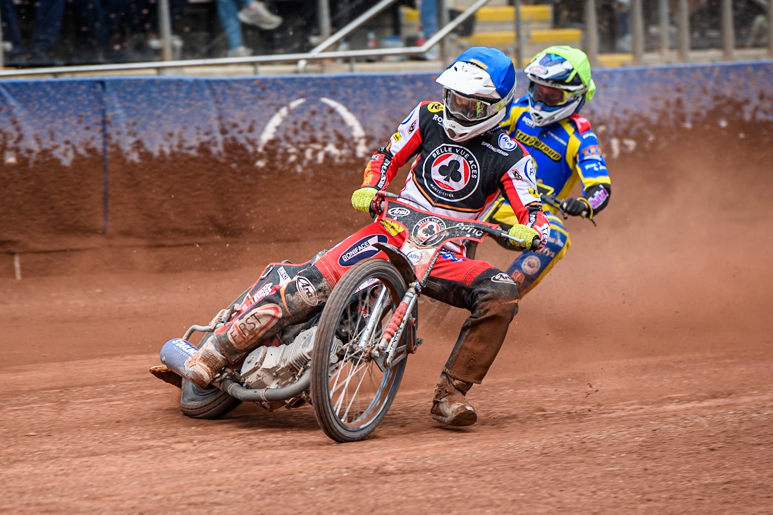Jake Mulford of Belle Vue Aces in Blue leading Leon Flint of Sheffield Tigers in Yellow during the Rowe Motor Oil Premiership match between Belle Vue Aces and Sheffield Tigers at the National Speedway Stadium, Manchester on Monday 5th May 2025. (Photo: Ian Charles | MI News)