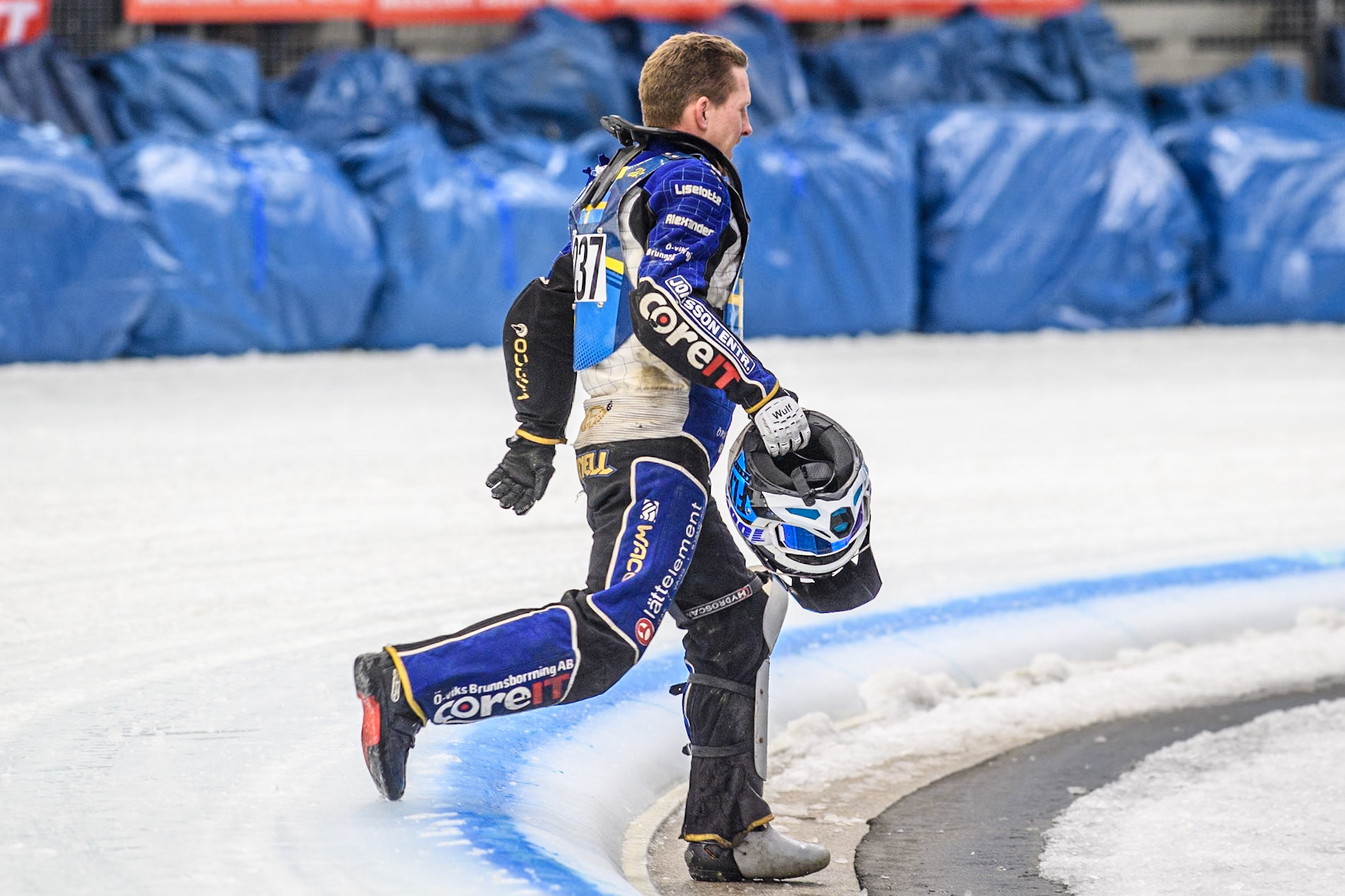 \237 walks back to the pits during the FIM Ice Speedway Gladiators World Championship Final 2 at the Max-Aicher-Arena, Inzell on Sunday 24 March 2024. (Photo: Ian Charles | MI News)