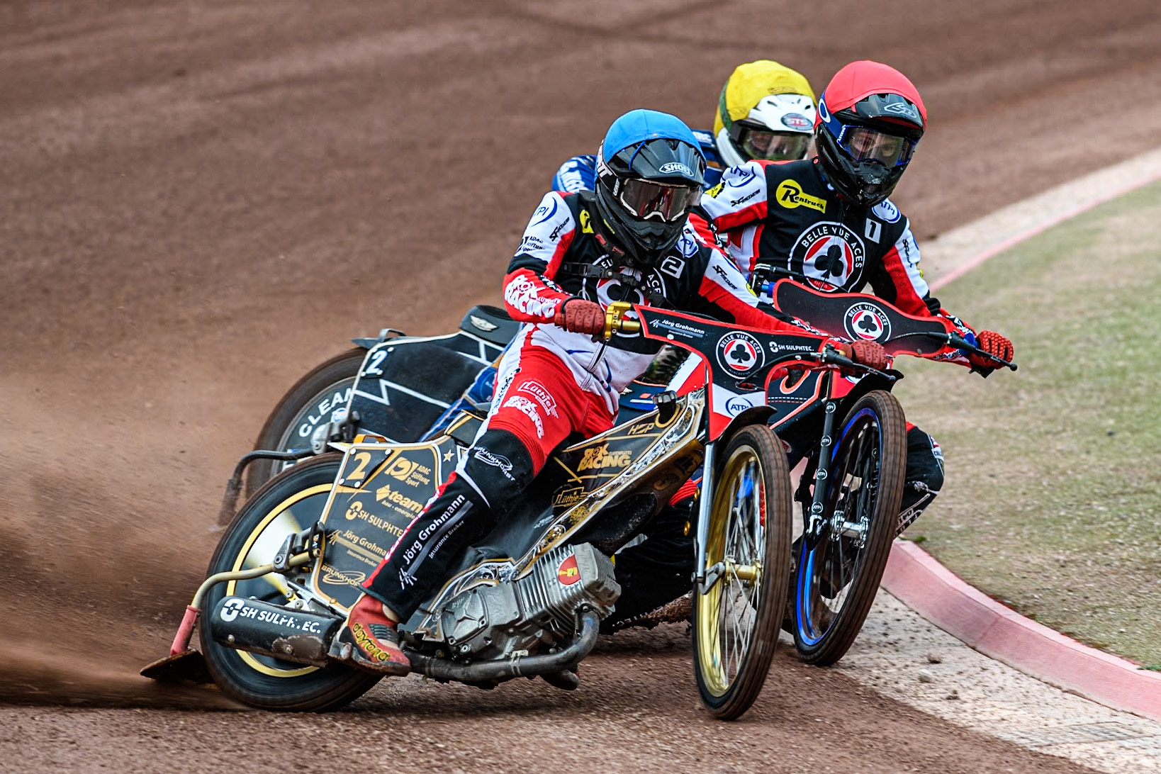Belle Vue Aces' Norick Blodorn in Blue and Belle Vue Aces' Brady Kurtz in Red hold out King Lynn Stars' Guest Richard Lawson during the Rowe Motor Oil Premiership match between Belle Vue Aces and King's Lynn Stars at the National Speedway Stadium, Manchester on Monday 20th May 2024. (Photo: Ian Charles | MI News)