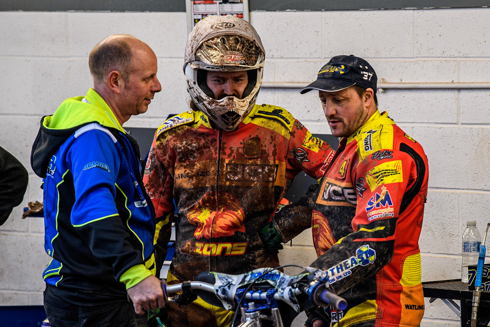Richard Lawson  (centre) and his mechanic (left) chat with Chris Harris (right) during the SGB Premiership match between Belle Vue Aces and Leicester Lions at the National Speedway Stadium, Manchester on Monday 1st May 2023. (Photo: Ian Charles | MI News)